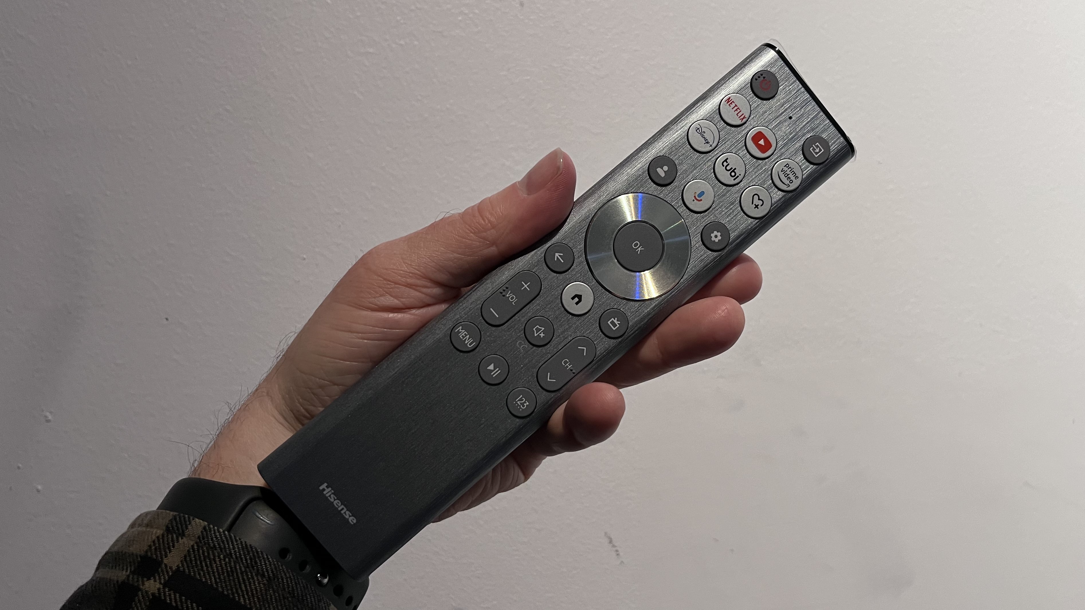 Hisense U9N TV remote control held in hand