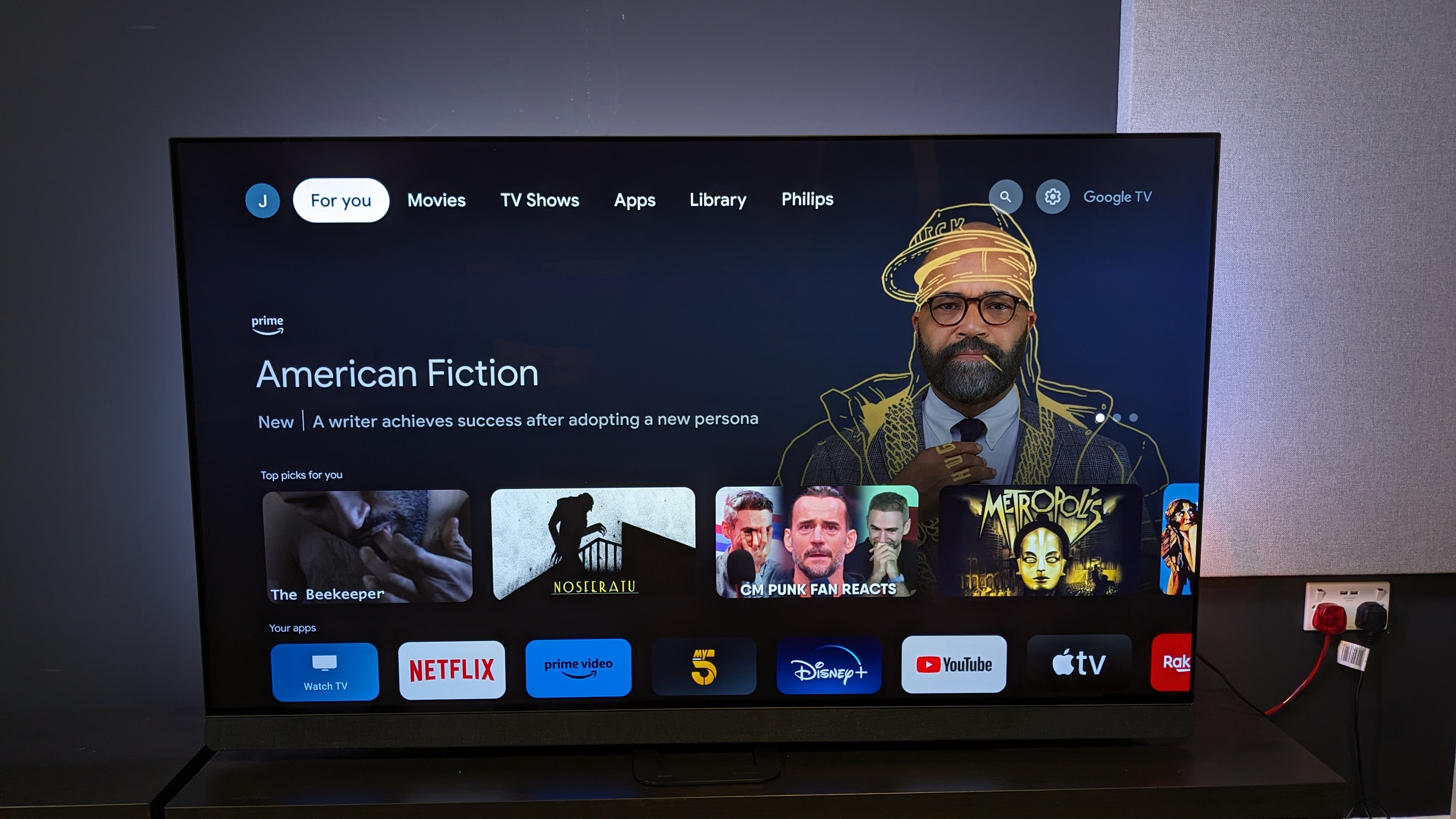 Philips OLED908 with Google TV home menu on screen