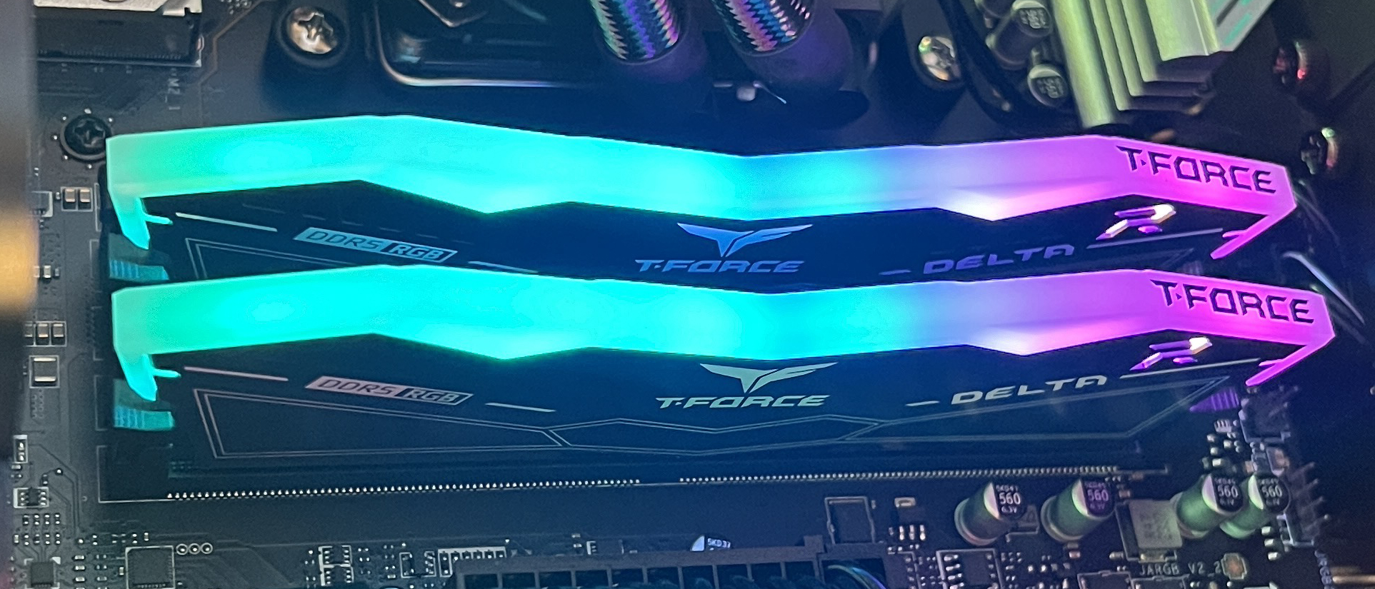A set of TeamGroup T-Force Delta RGB DDR5 RAM modules in a motherboard