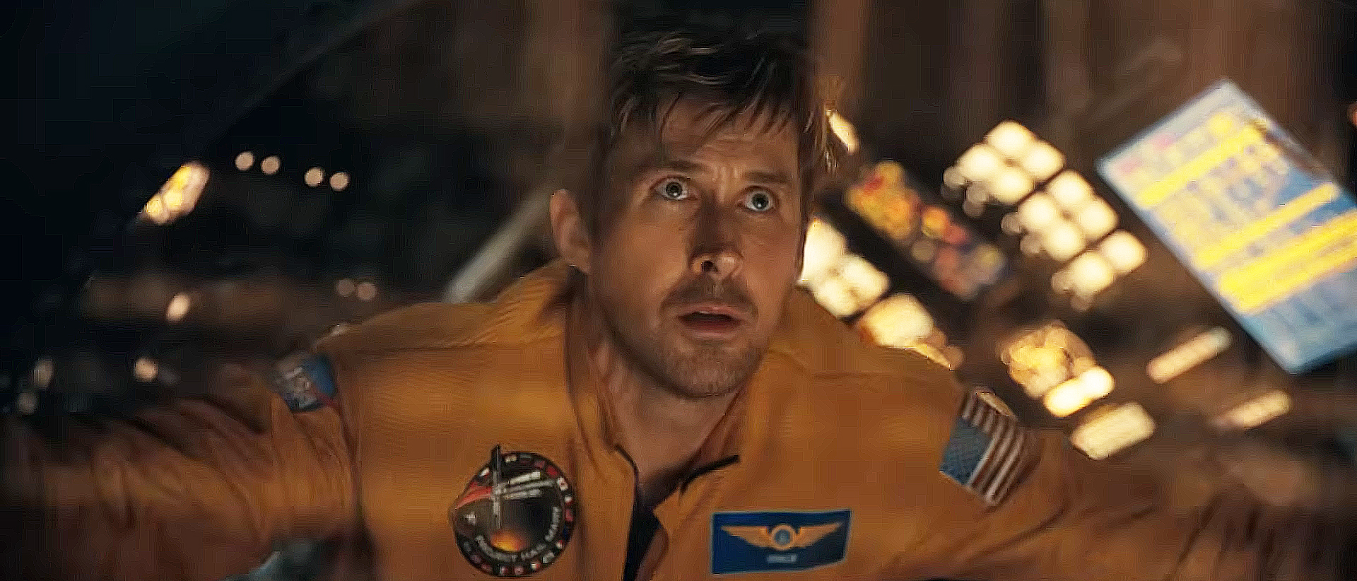 Ryan Gosling's Ryland Grace staring out of a starship window and into space in Project Hail Mary