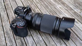 Nikkor Z 70-180mm f/2.8 attached to a Nikon Z 7II on a wooden outdoor table