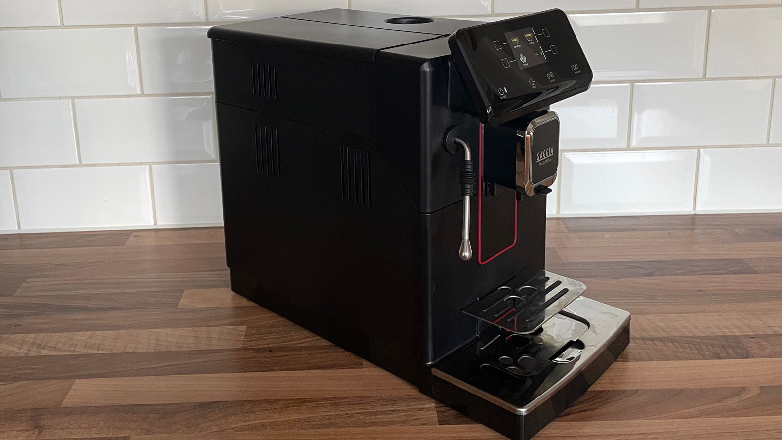 The side view of the Gaggia Magenta Plus coffee machine