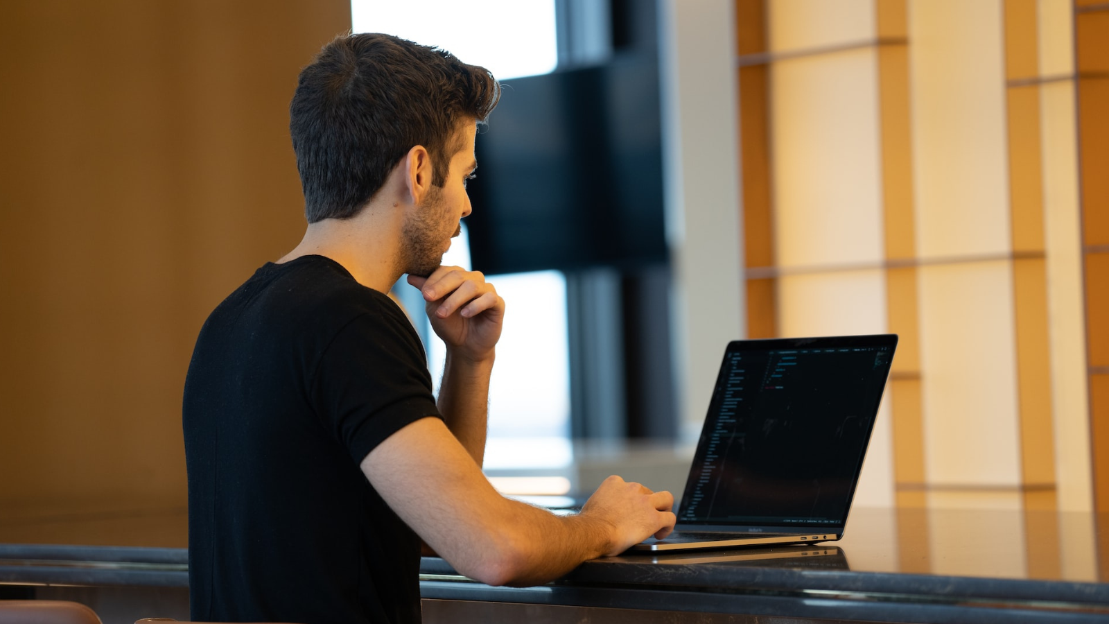 Person using laptop in office