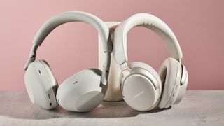 Sony WH-1000XM6 and Bose QuietComfort Ultra leaning on pole