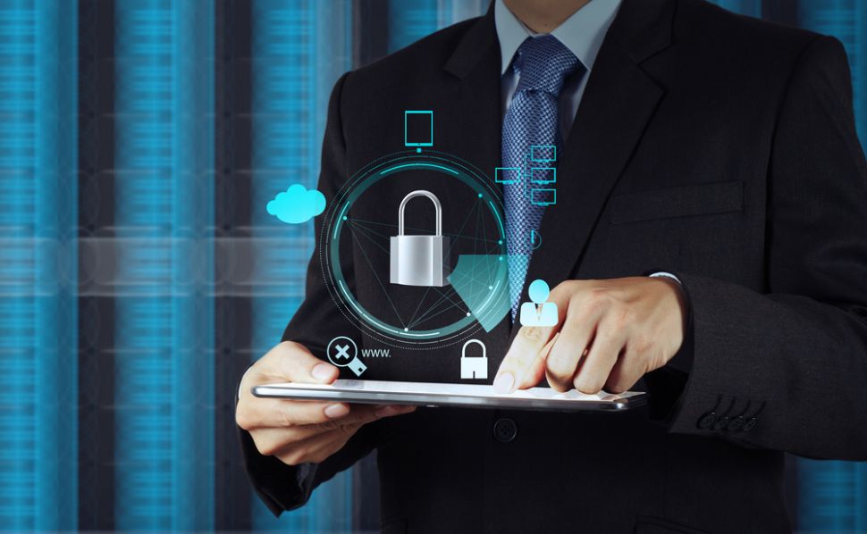 A person using a business tablet with security protection.