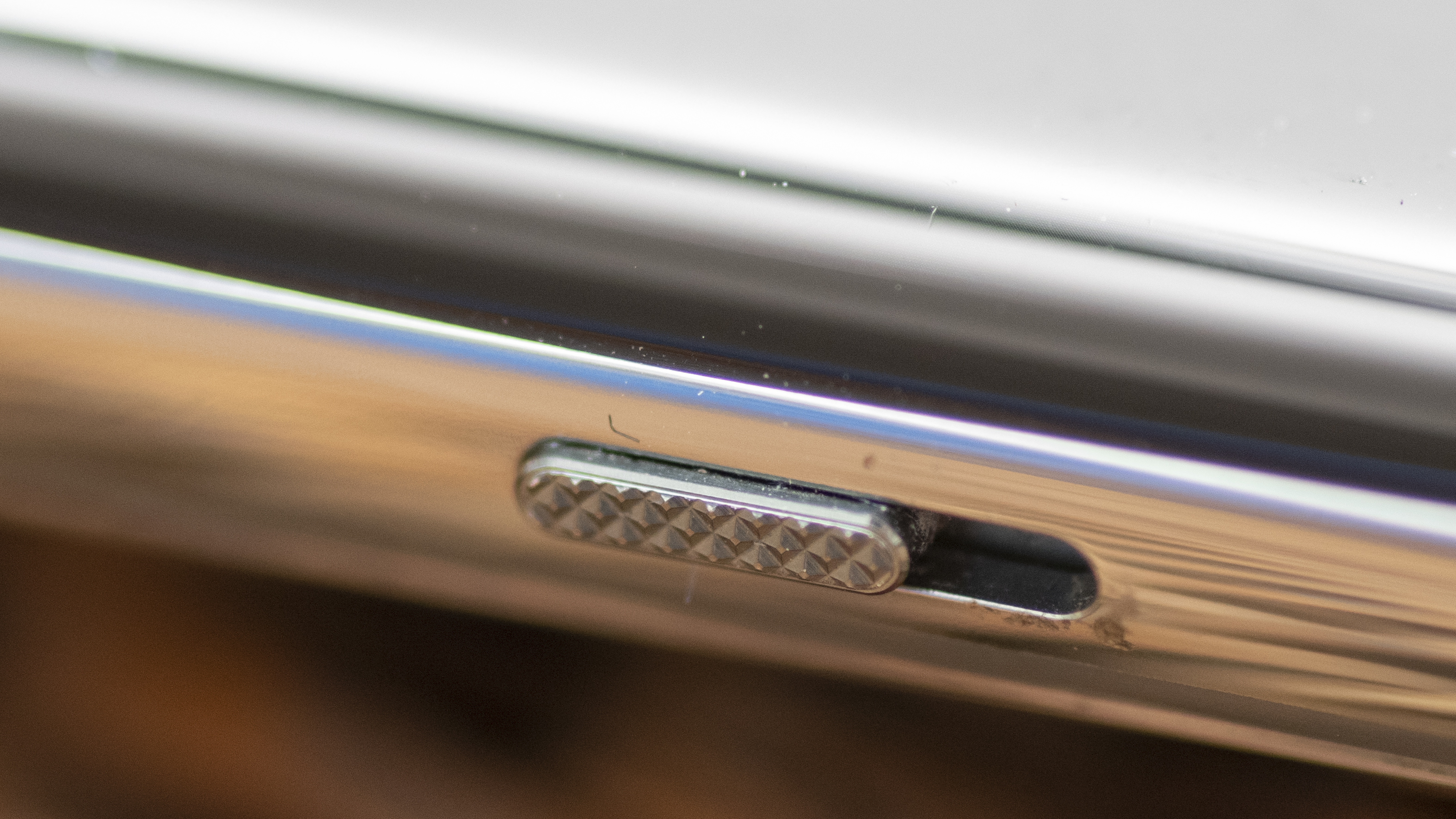 OnePlus 11 in green on wicker basket top with screen on