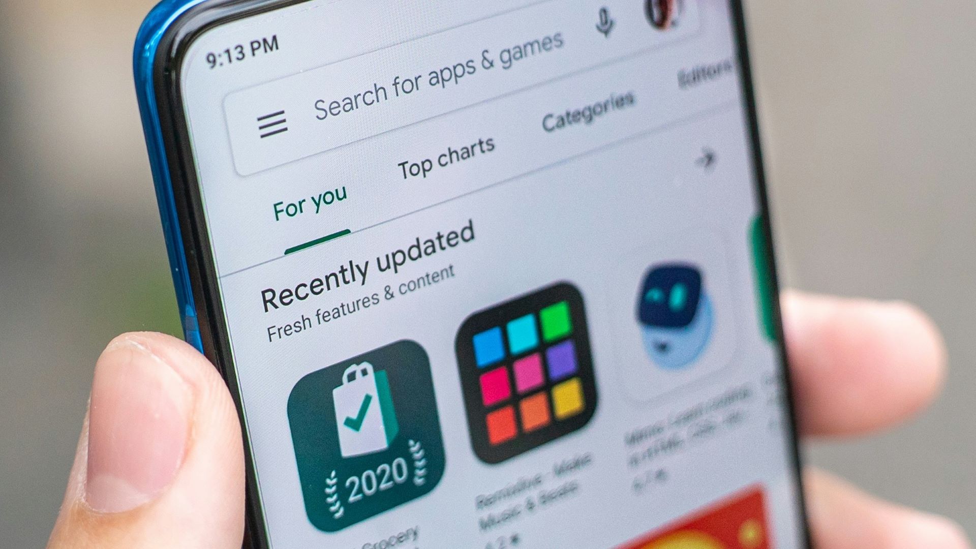 A close-up photo of the Google play store displayed on an Android phone