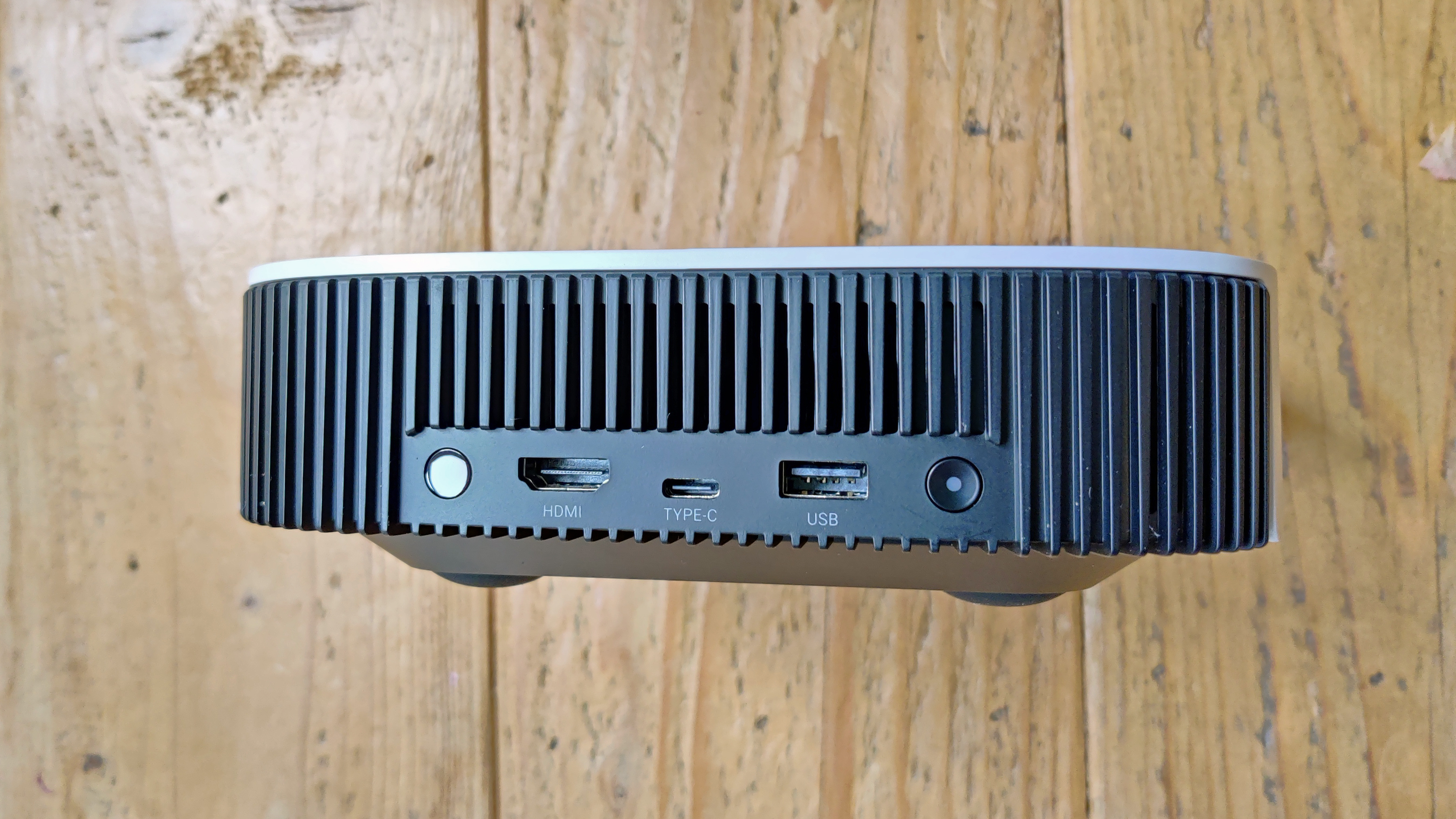 Anker Nebula Solar Portable projector against wooden background