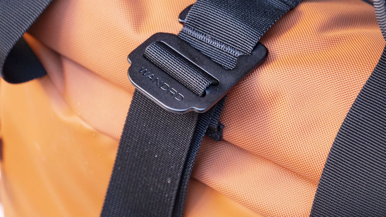 Wandrd PRVKE V4 bag on a white metal bench