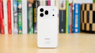The Honor 600 Pro resting on a wooden table