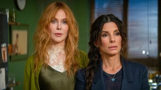 Nicole Kidman and Sandra Bullock look at something offscreen