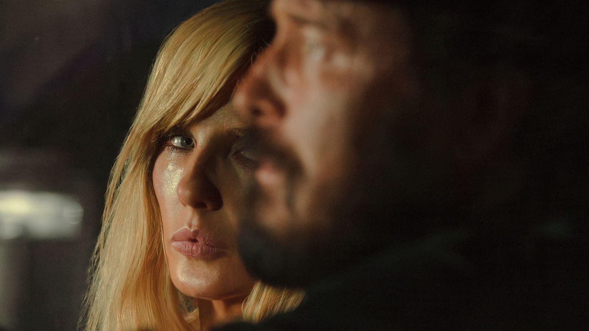 Beth looks at Rip sat next to her