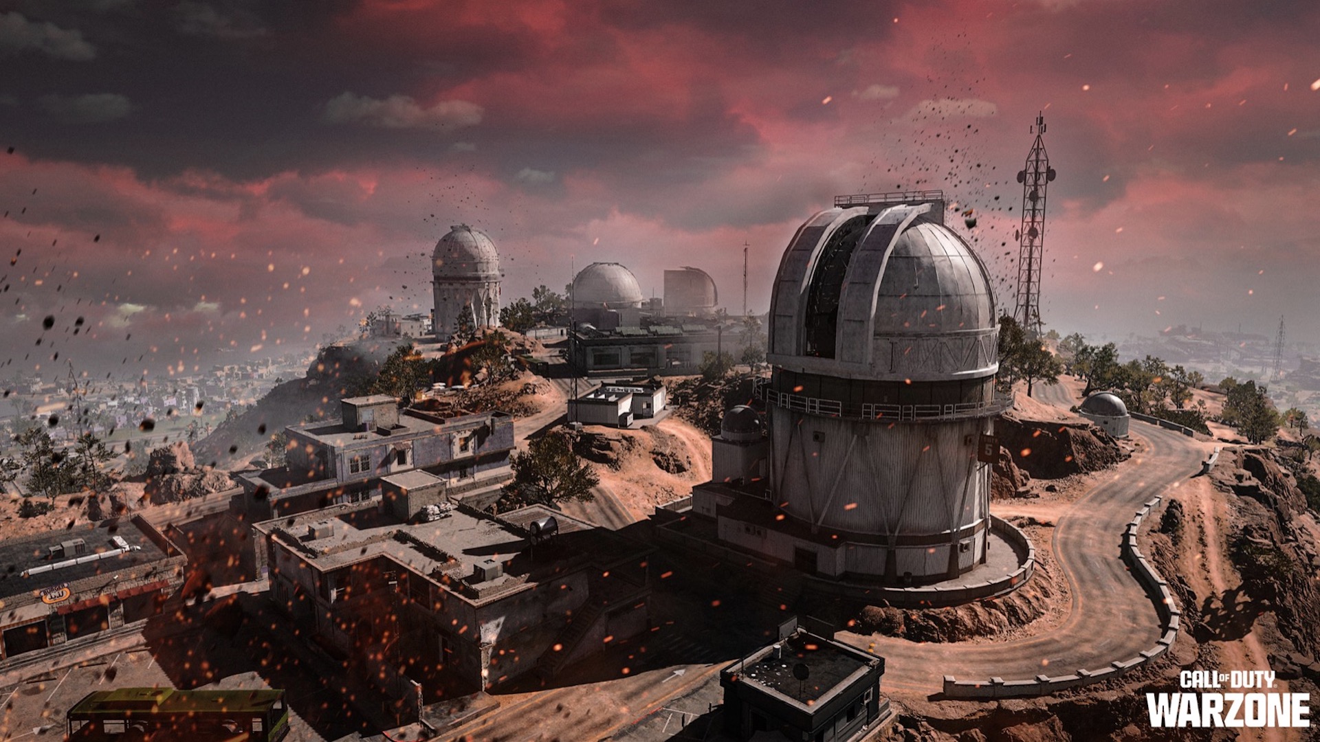 A red sky covers a derelict factory area
