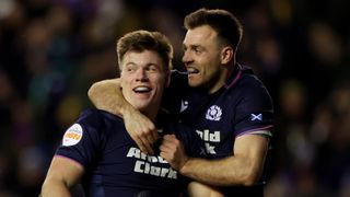 Huw Jones of Scotland celebrates scoring his team's fourth try with teammate Ben White during the Guinness Six Nations 2026 match between Scotland and England at Scottish Gas Murrayfield on February 14, 2026 in Edinburgh, Scotland.