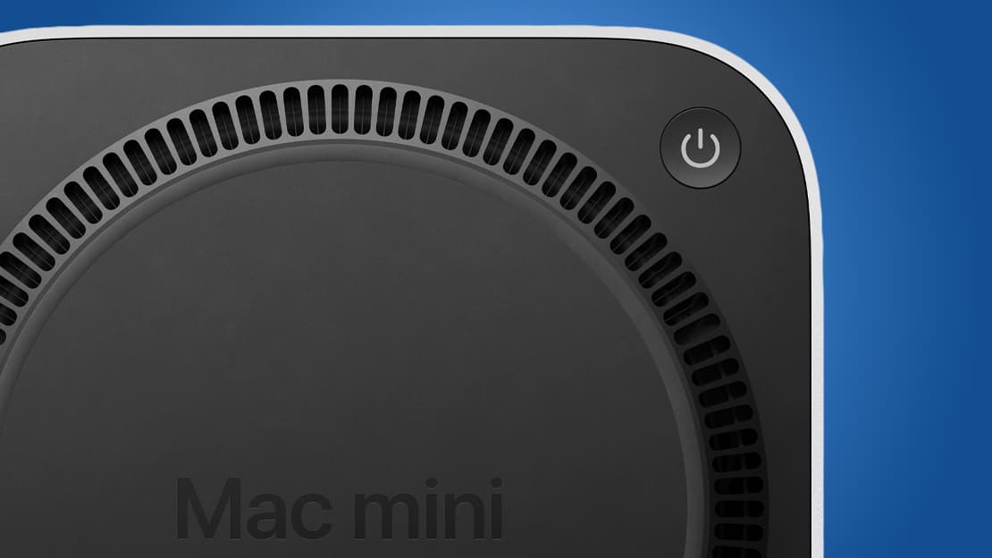 The underside of the M4 Mac mini, showing its power button.