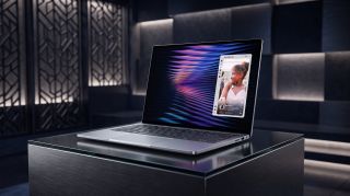 A Dell XPS 13 laptop sitting on a black marble pedestal in a sleek black futuristic environment