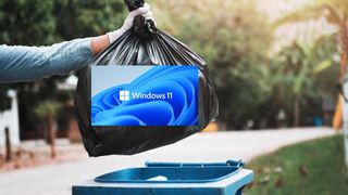 Someone putting some trash branded as Windows 11 into a bin.