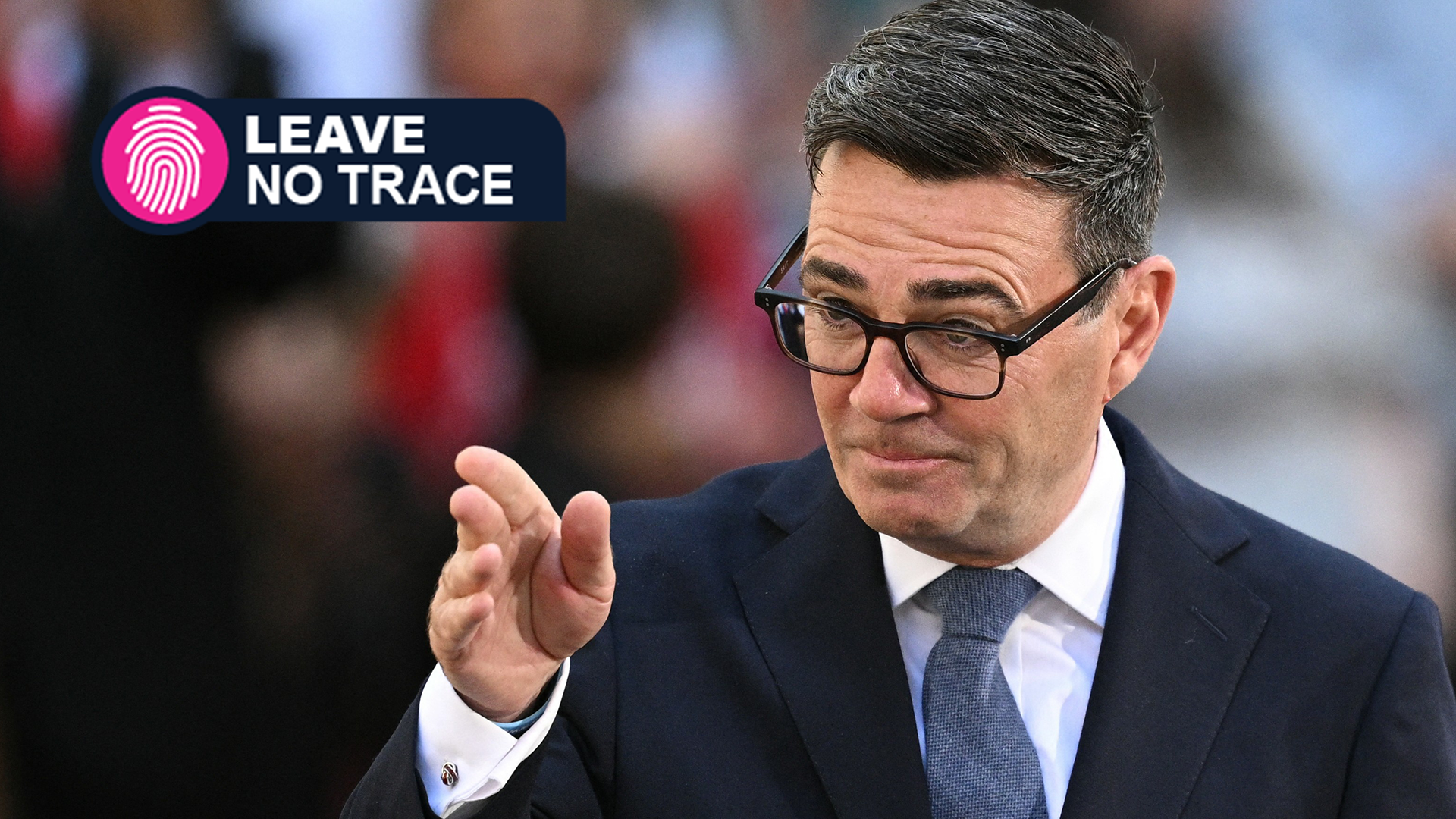 Britain's new Prime Minister Andy Burnham gives his first speech in front of 10 Downing Street in central London on July 20, 2026, with the Leave No Trace logo on the top left
