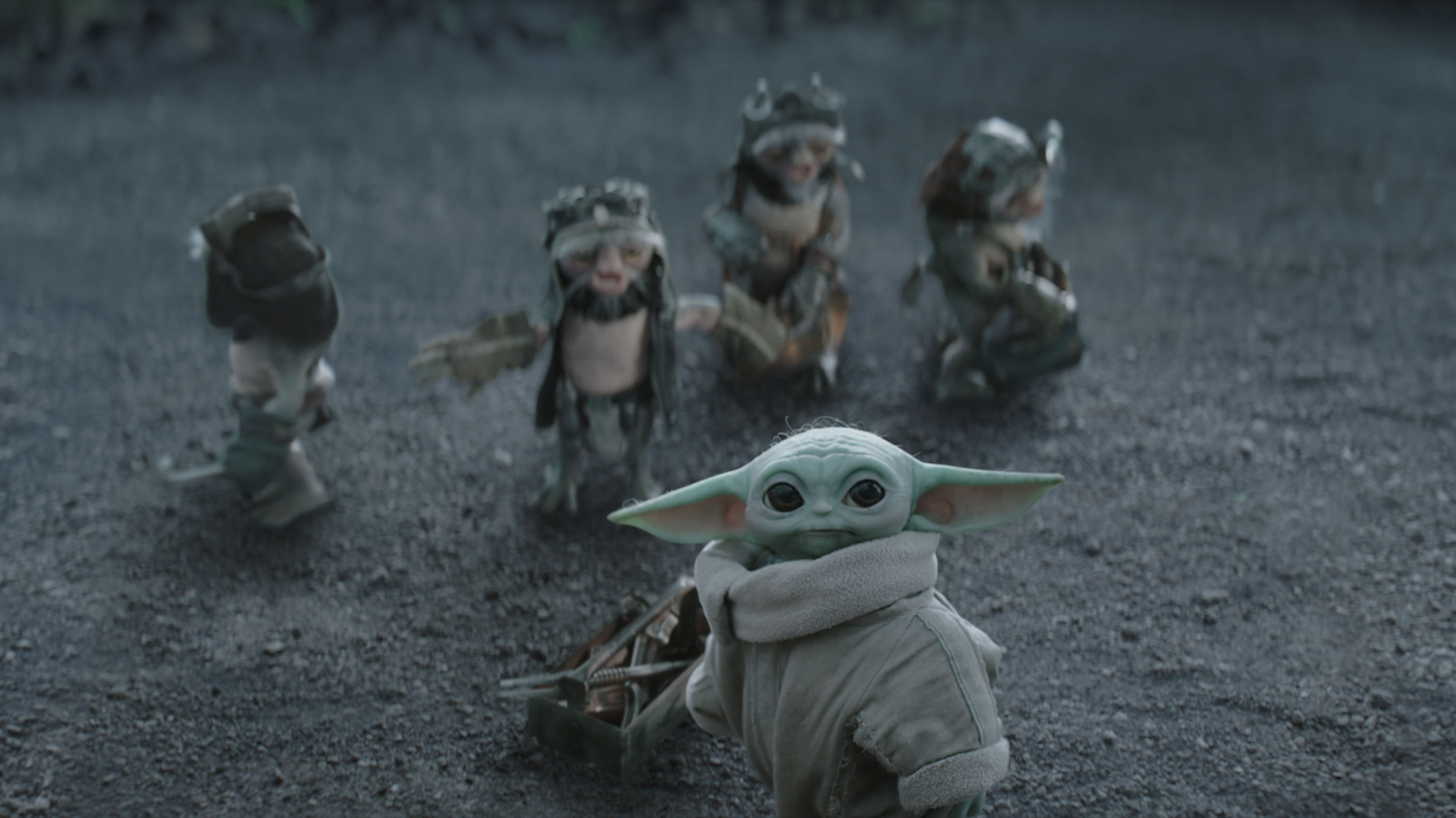 Baby Yoda and the Anzellans looking up at something in The Mandalorian and Grogu