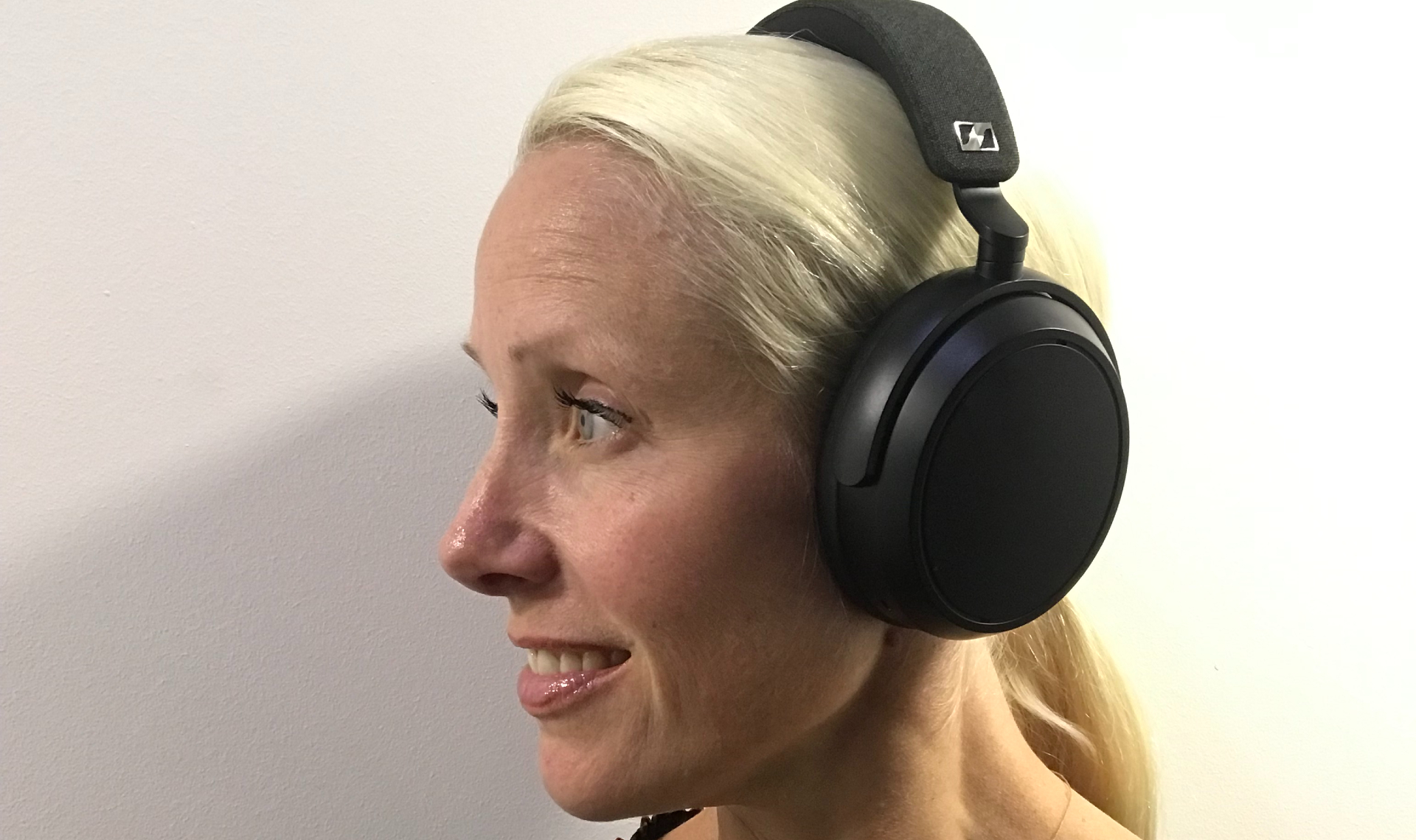 Audio editor Becky Scarrott wearing the Sennheiser Momentum 4 Wireless on white background