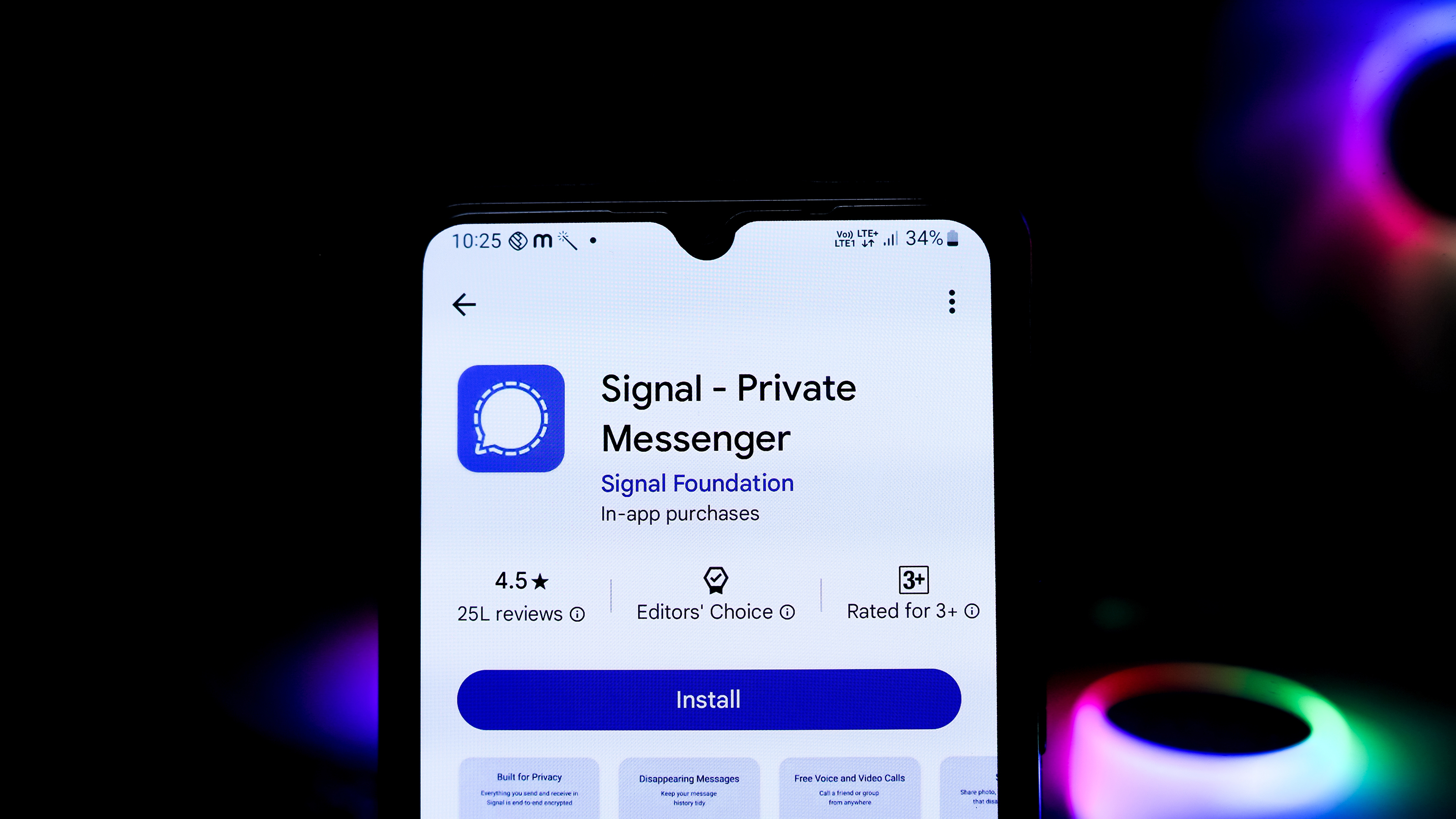 A smartphone showing the Signal app download page on a dark background