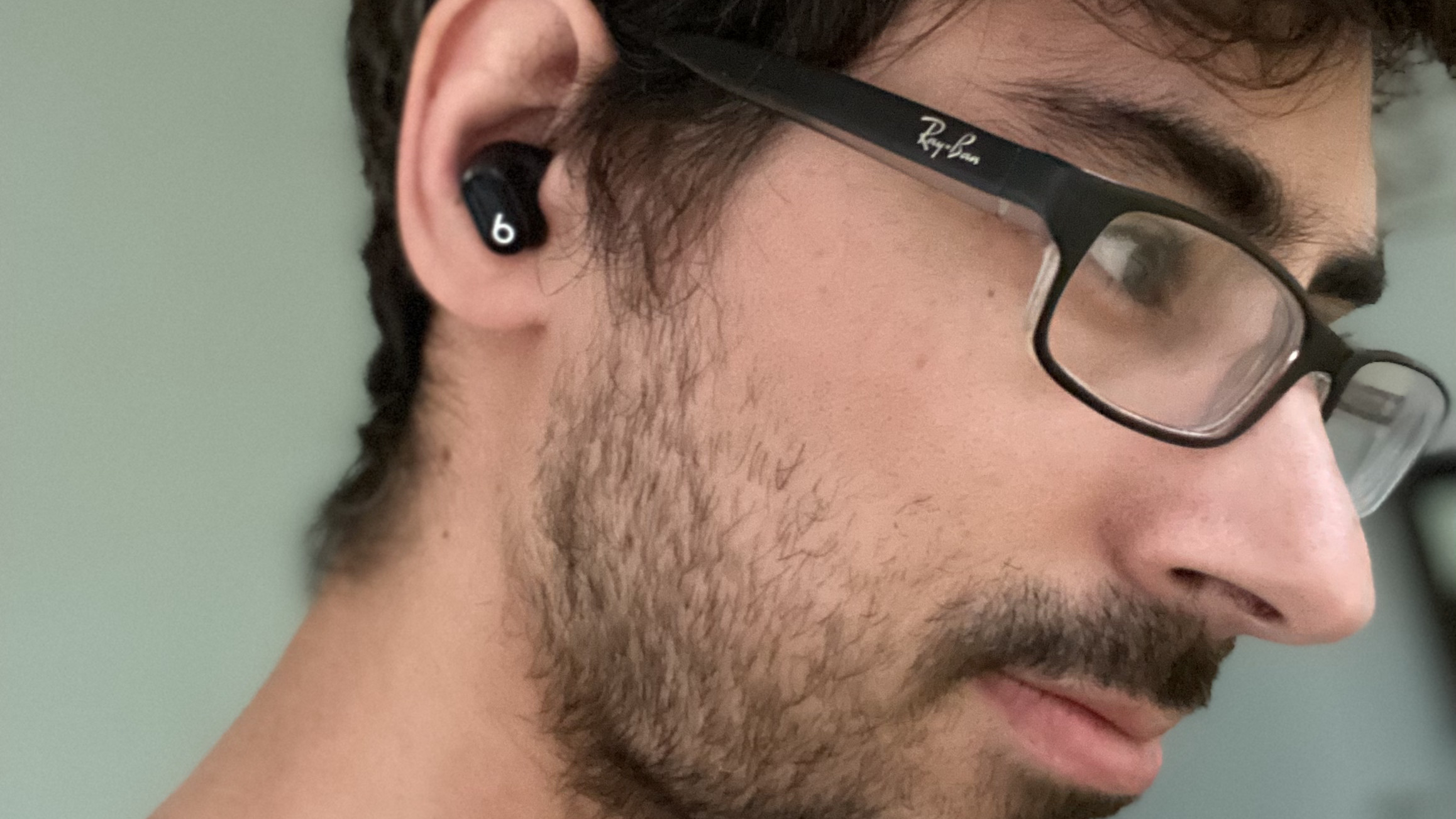Beats Studio Buds in black worn by a man