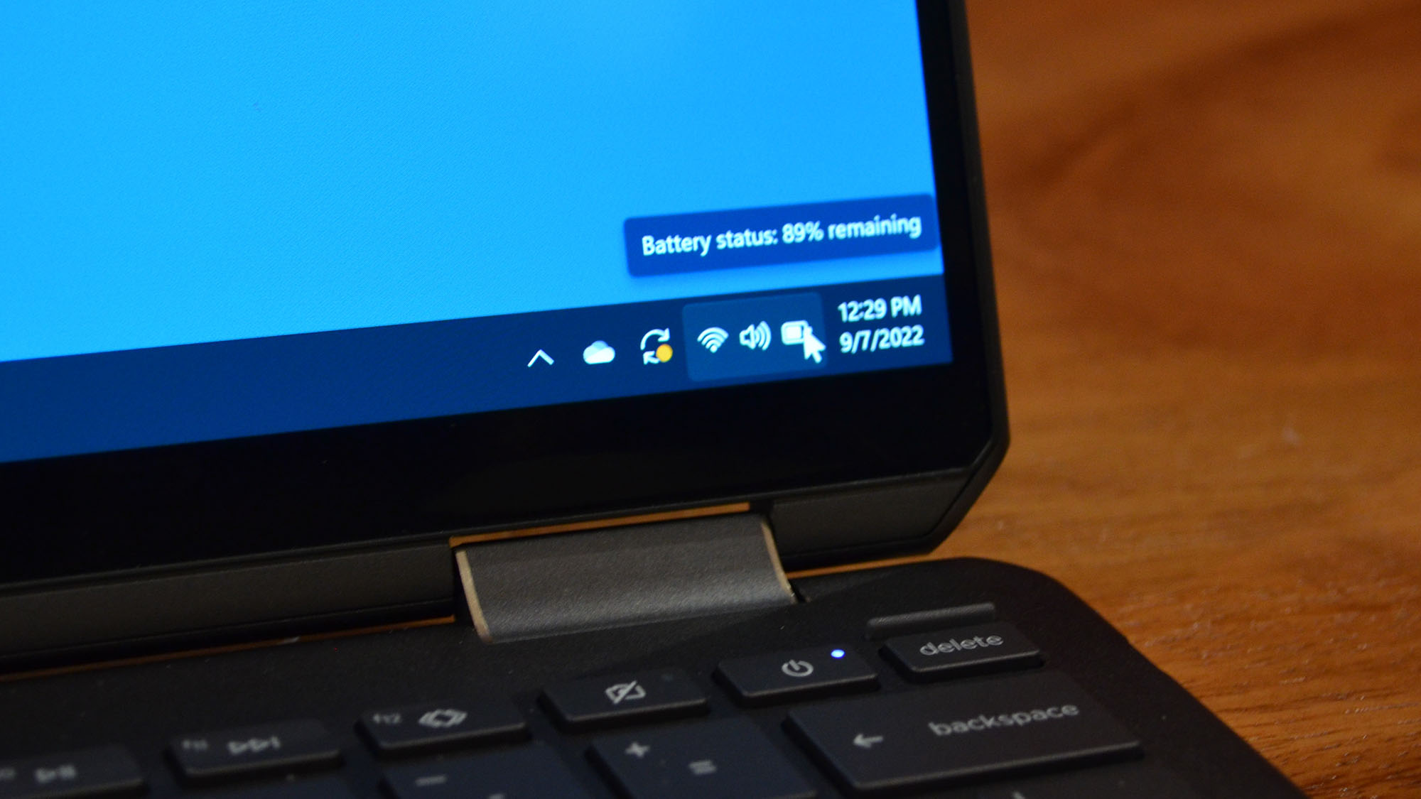 An HP Spectre x360 2022 on a wooden table