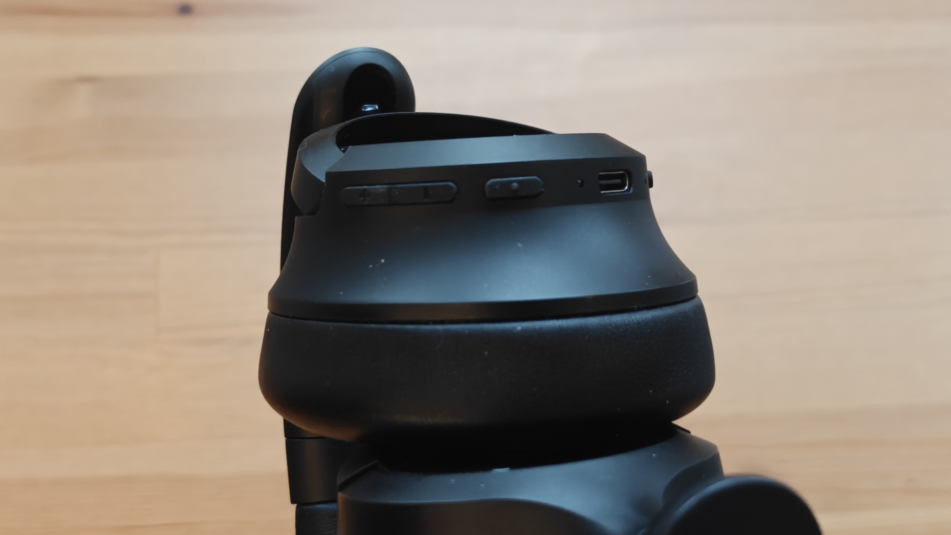 The OneOdio Focus A1 Pro on a wooden table.