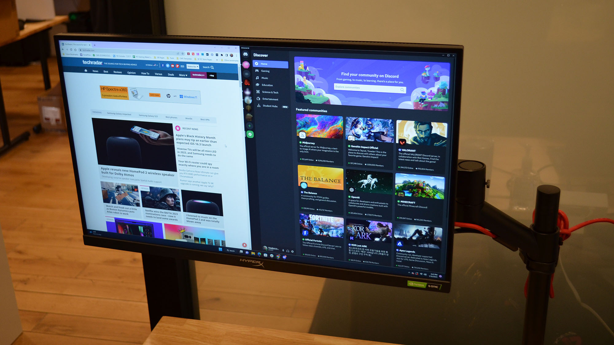 A HyperX Armada 27 on a wooden desk