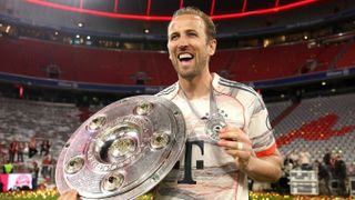 Harry Kane of Bayern Munich poses for a photo with the Meisterschale trophy and his medal after the teams 2-0 victory in the Bundesliga match between FC Bayern M&uuml;nchen and Borussia M&ouml;nchengladbach at Allianz Arena on May 10, 2025 in Munich, Germany.