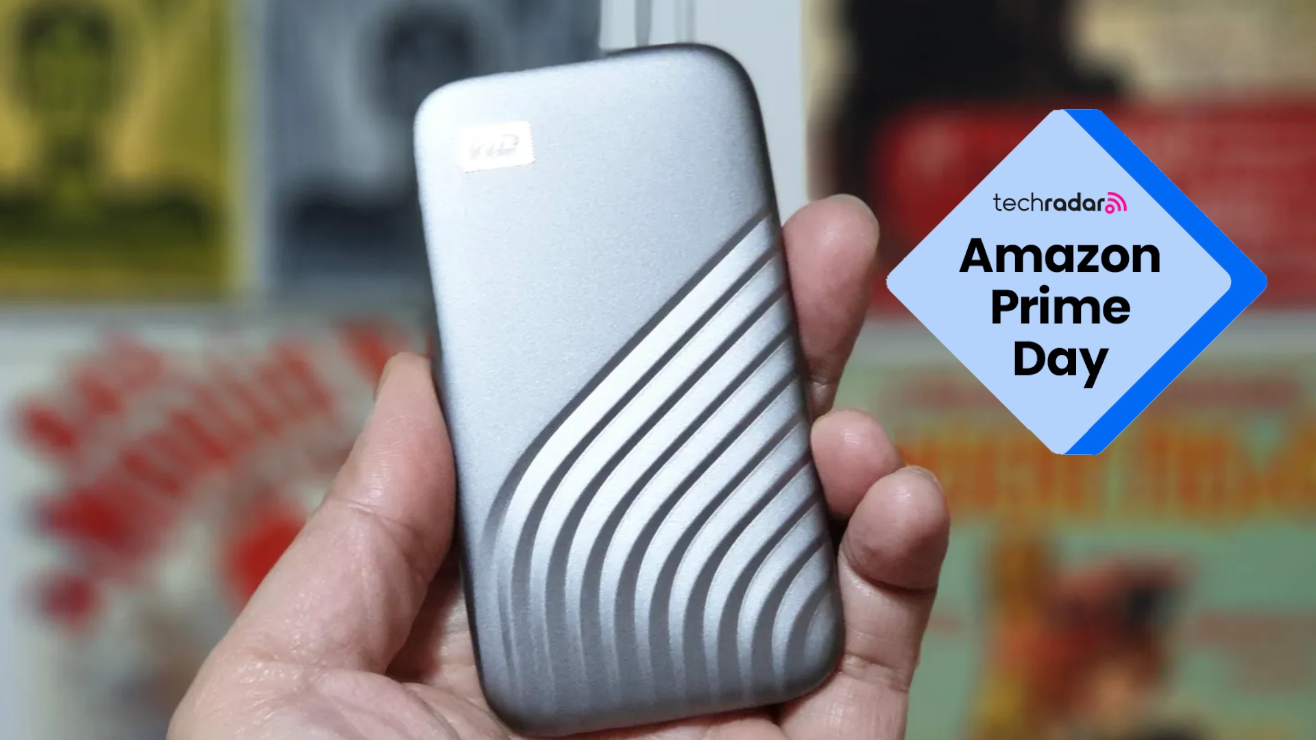 Hand holding Western Digital My Passport portable SSD with Amazon Prime Day text overlay