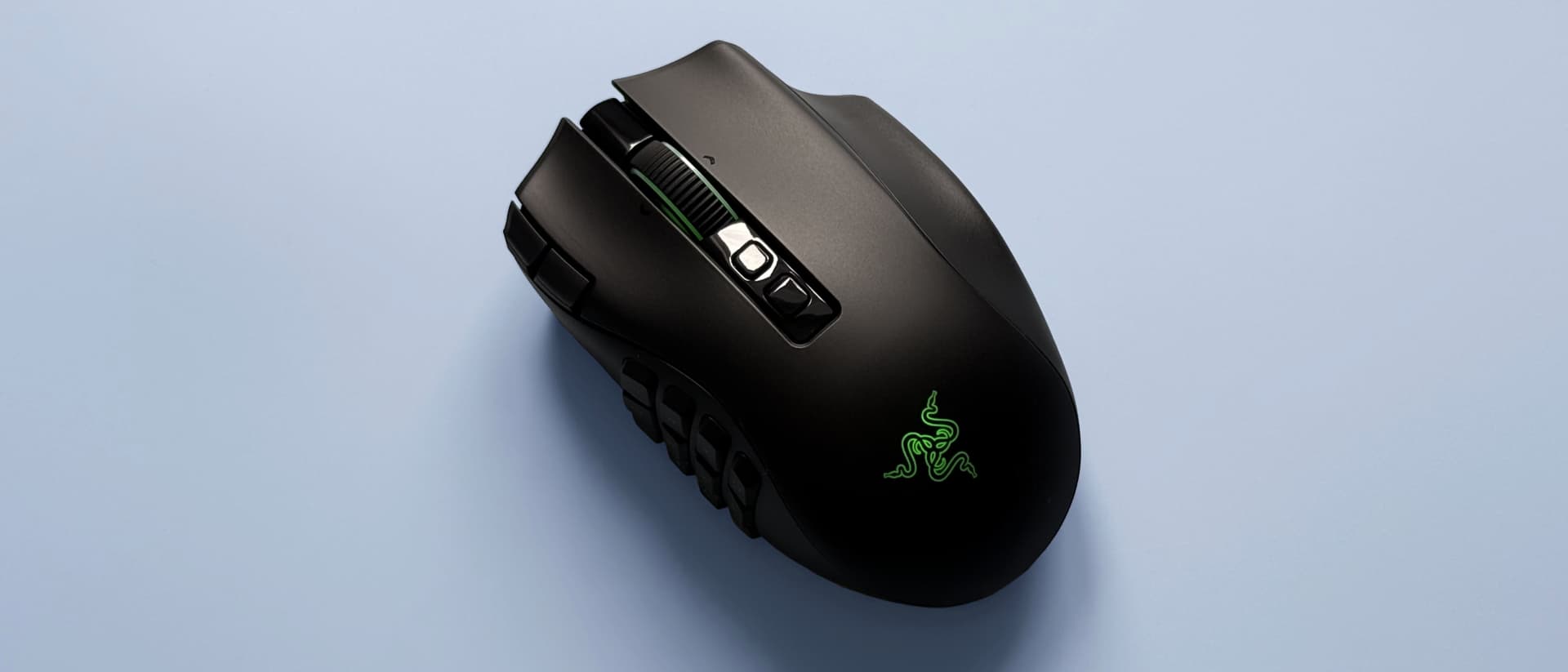 The Razer Naga V3 Pro mouse against a blue background.
