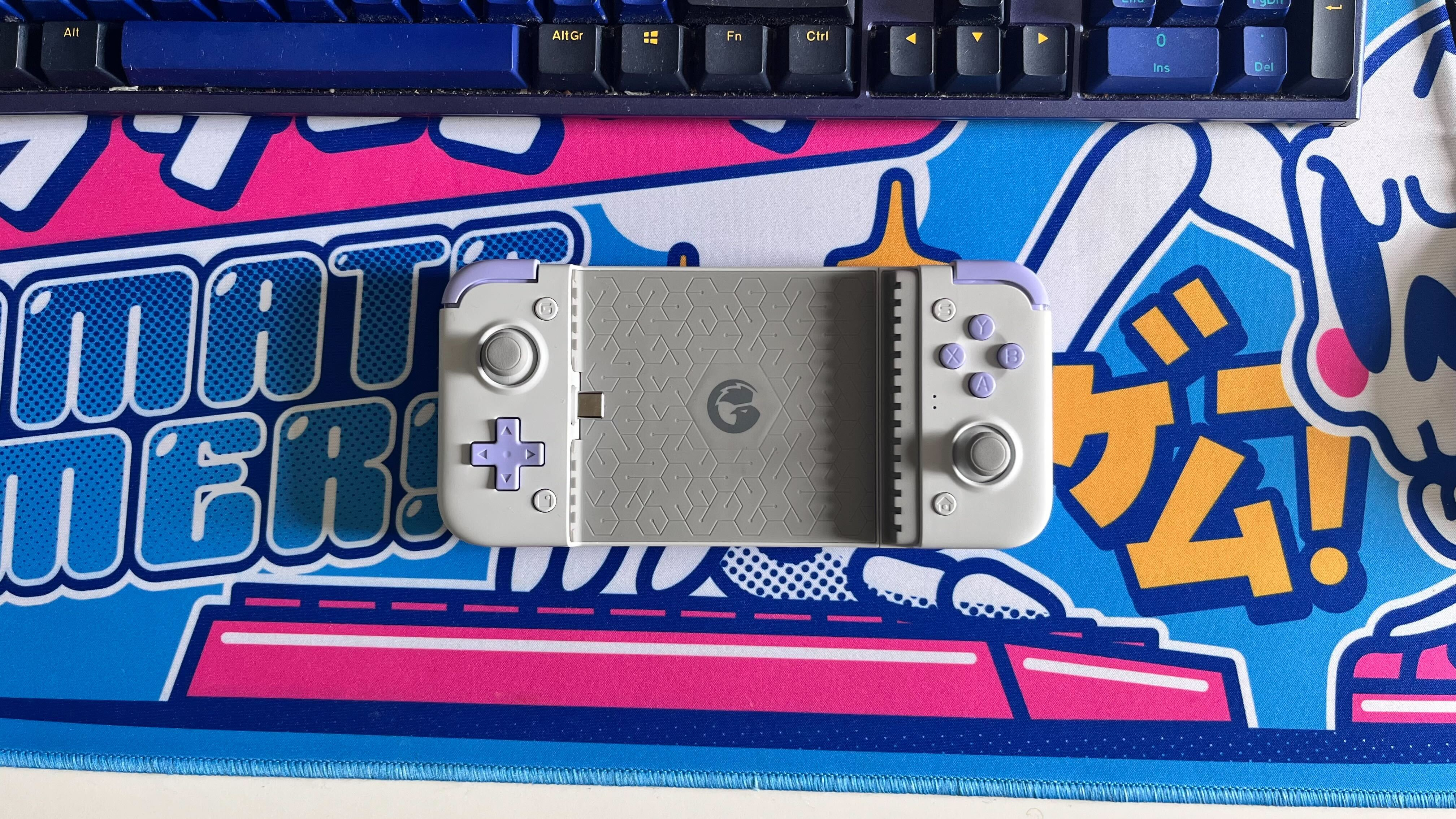 The GameSir X2s Type-C on a colorful desk mat