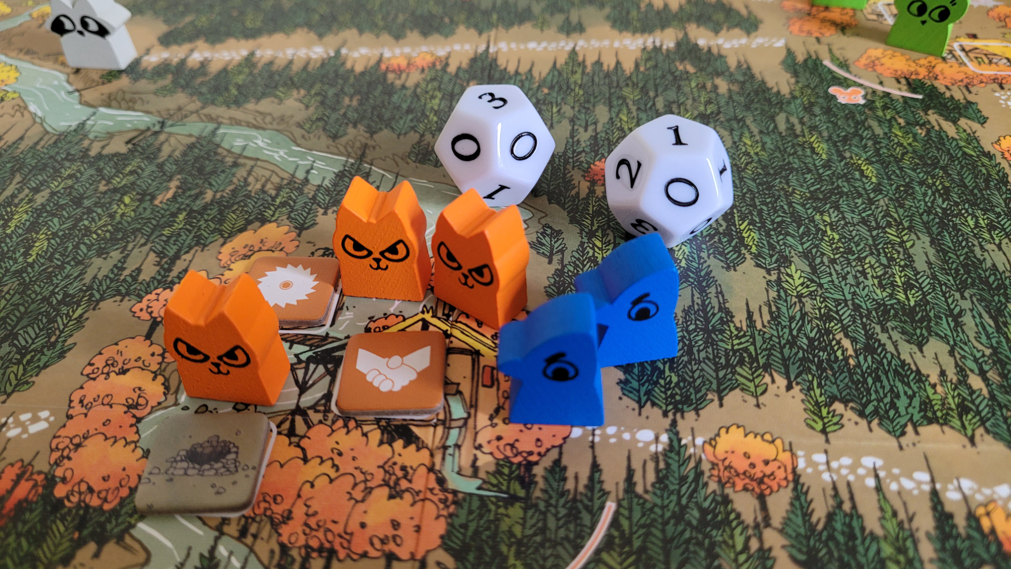 Close up of pieces from the Root board game