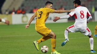 Trent Sainsbury of Australia fights for the ball against Jordan