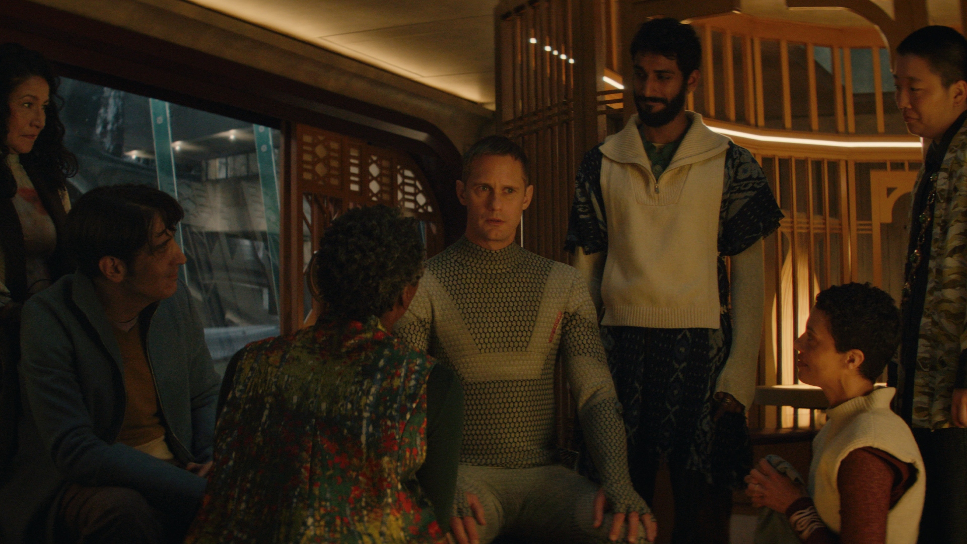 Murderbot sits with his team in Murderbot season 1