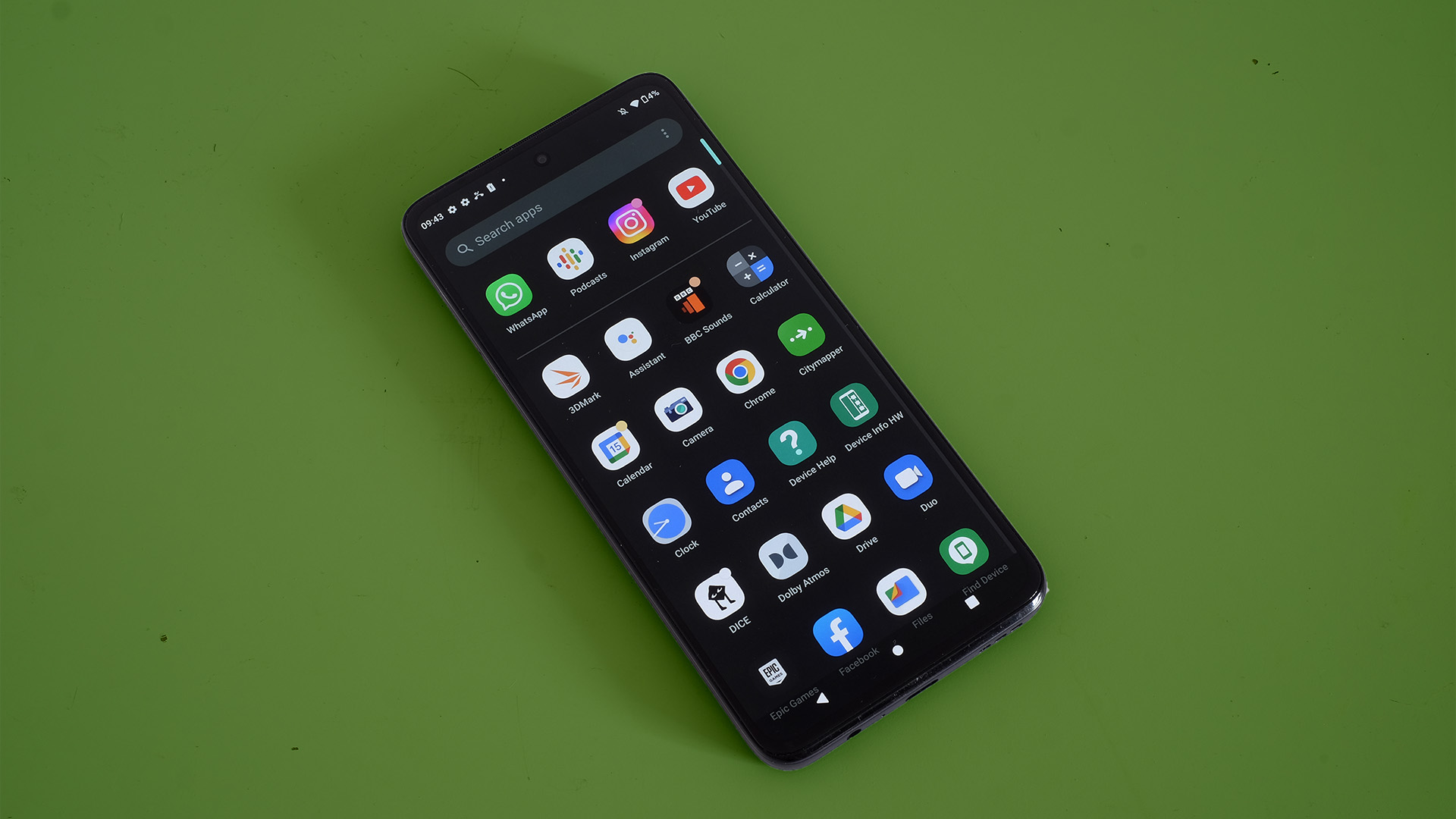 Motorola Moto G82 front angled apps drawer on green background