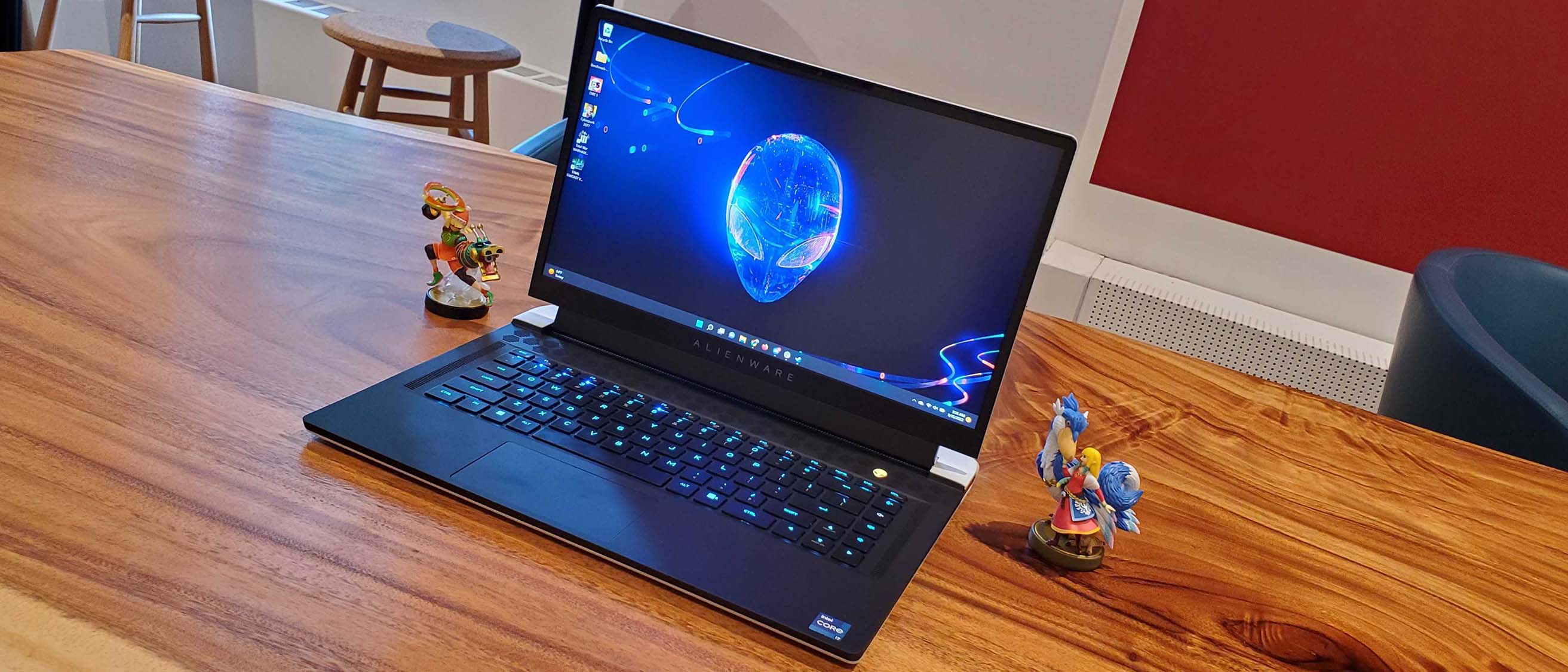 An Alienware x15 R2 gaming laptop on a wooden table