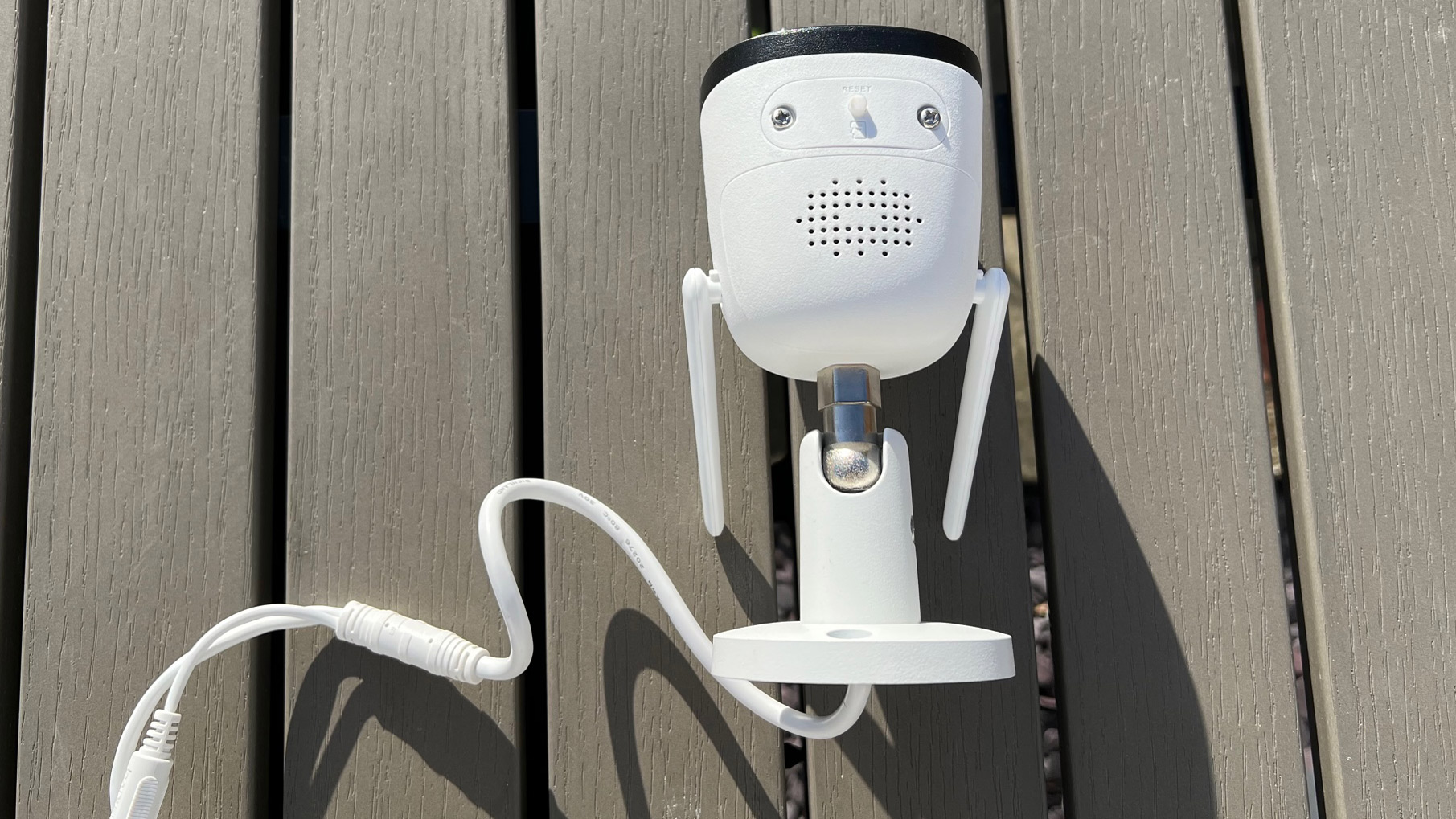 The back view of the Imou Bullet 2 on a garden table