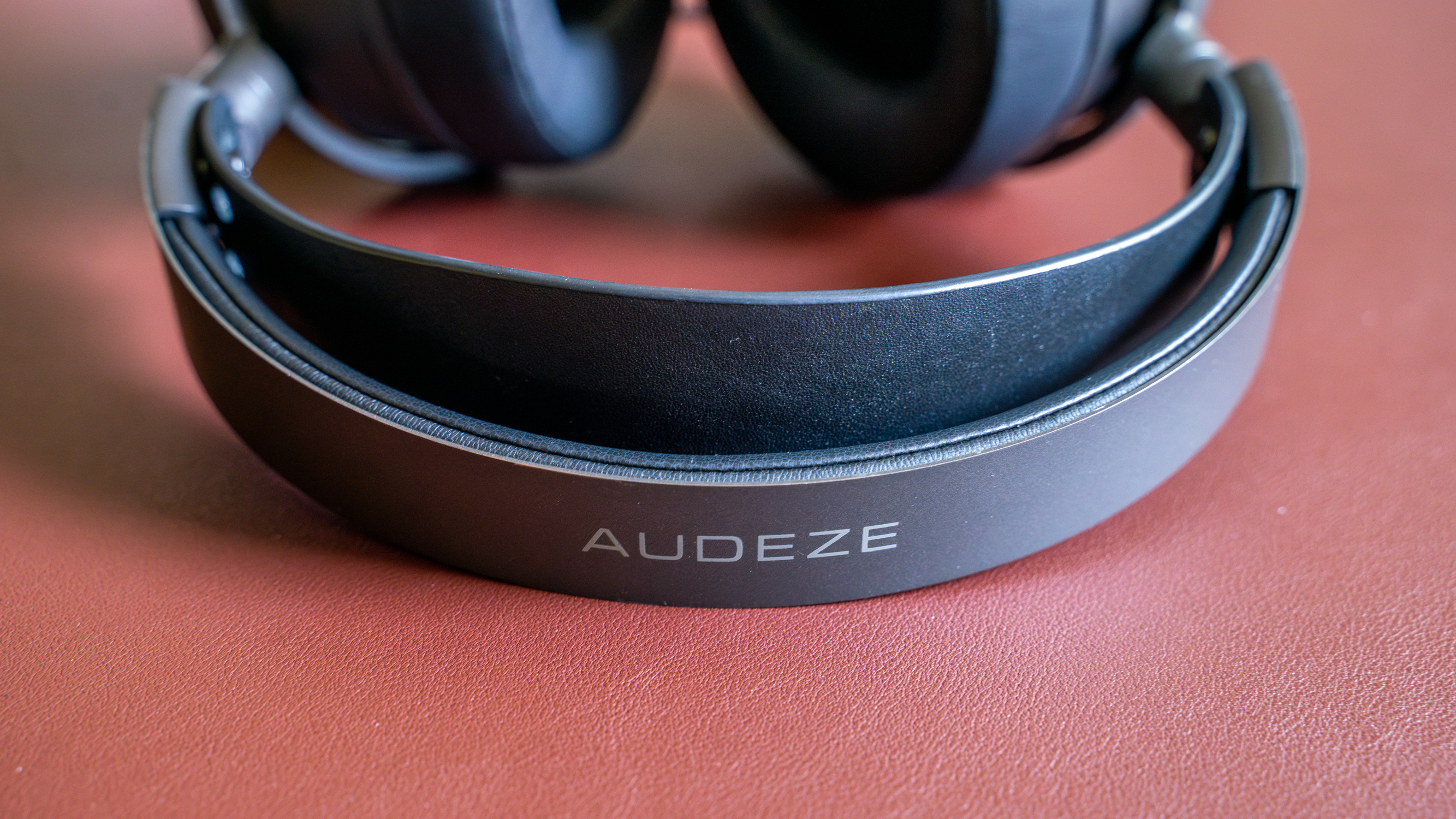 Audeze Maxwell on a burgundy mat