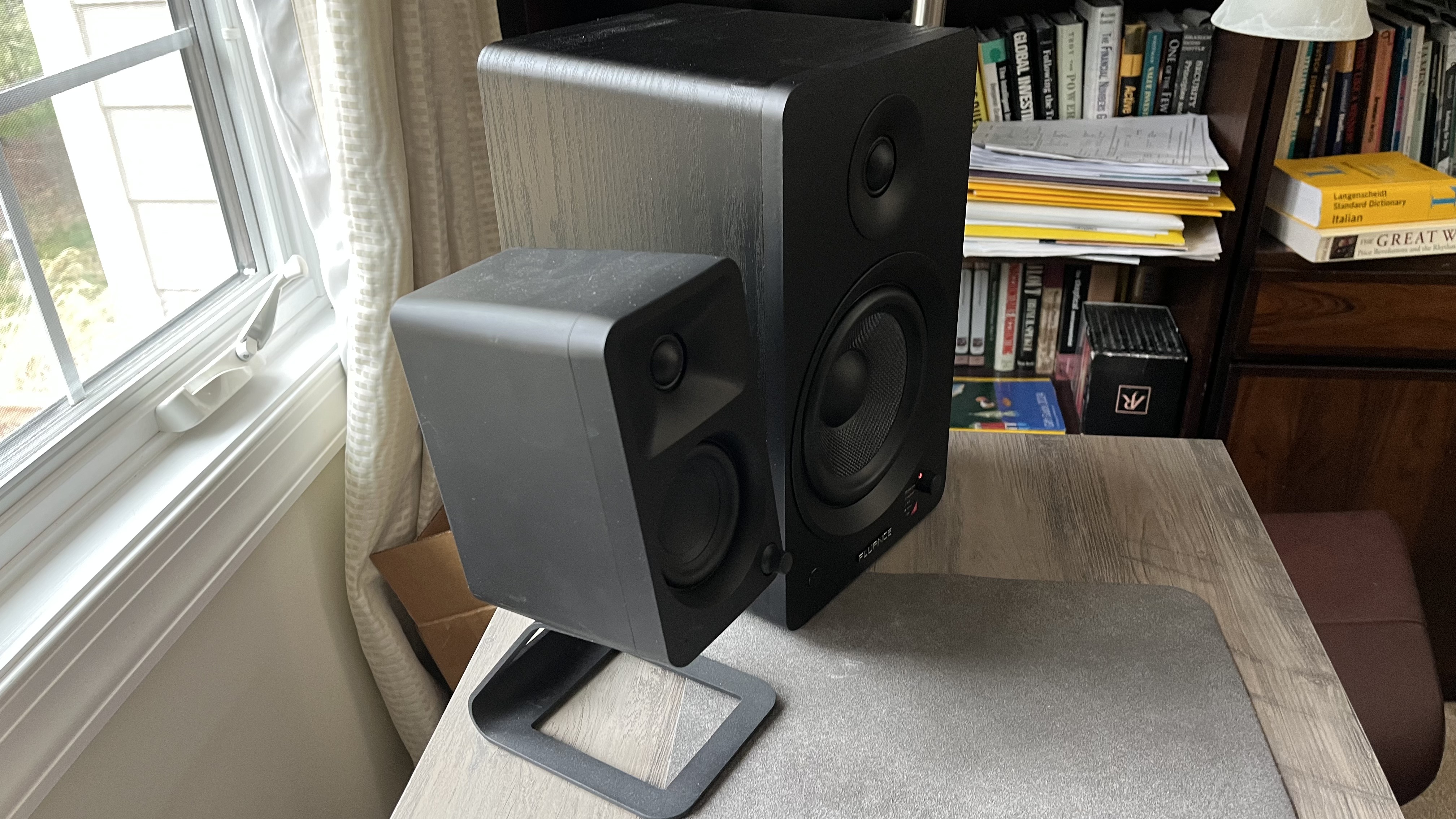 Fluance Ai61 and Kanto Ora speakers on a desk