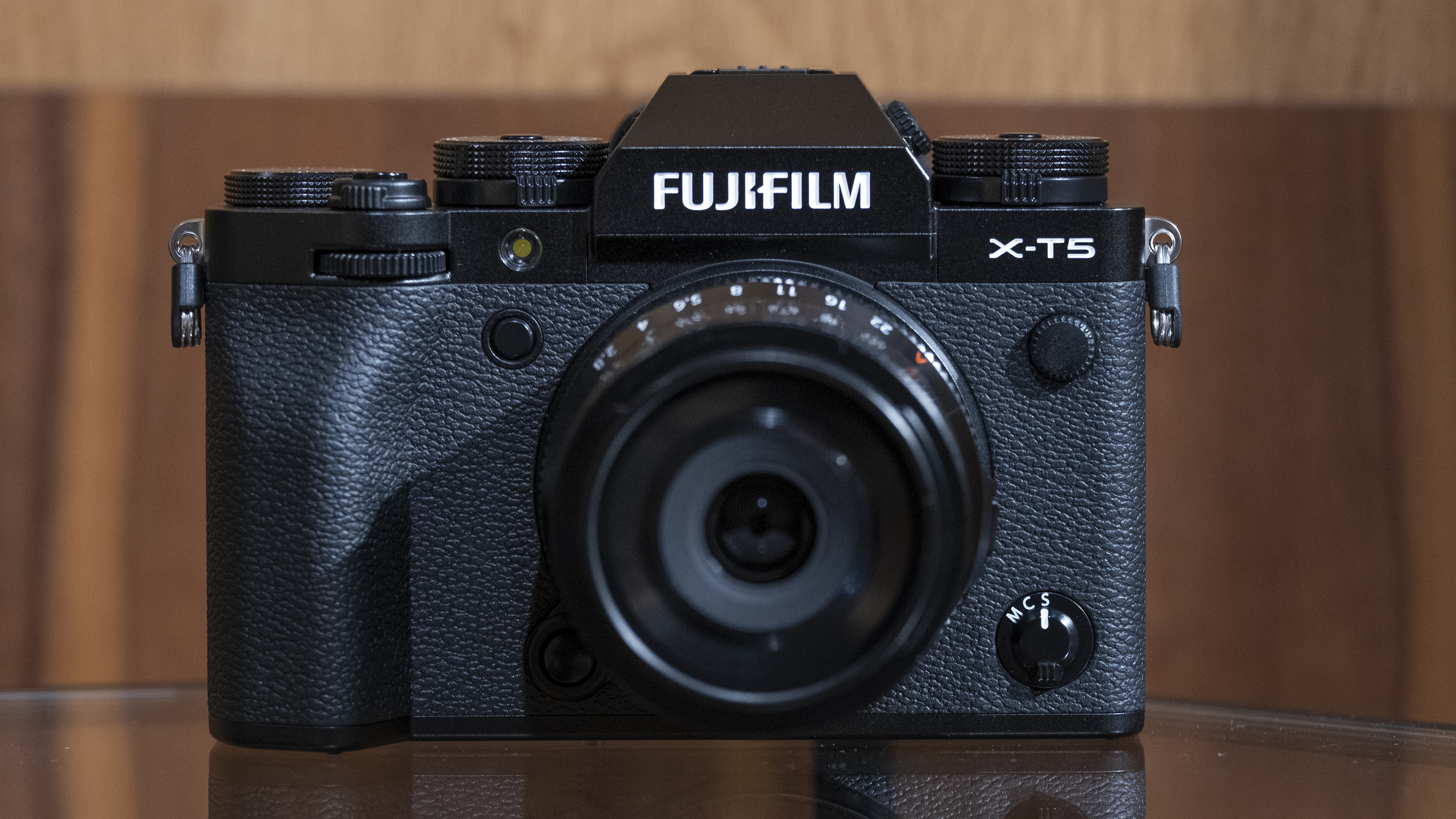 The Fujifilm X-T5 camera sitting on a table