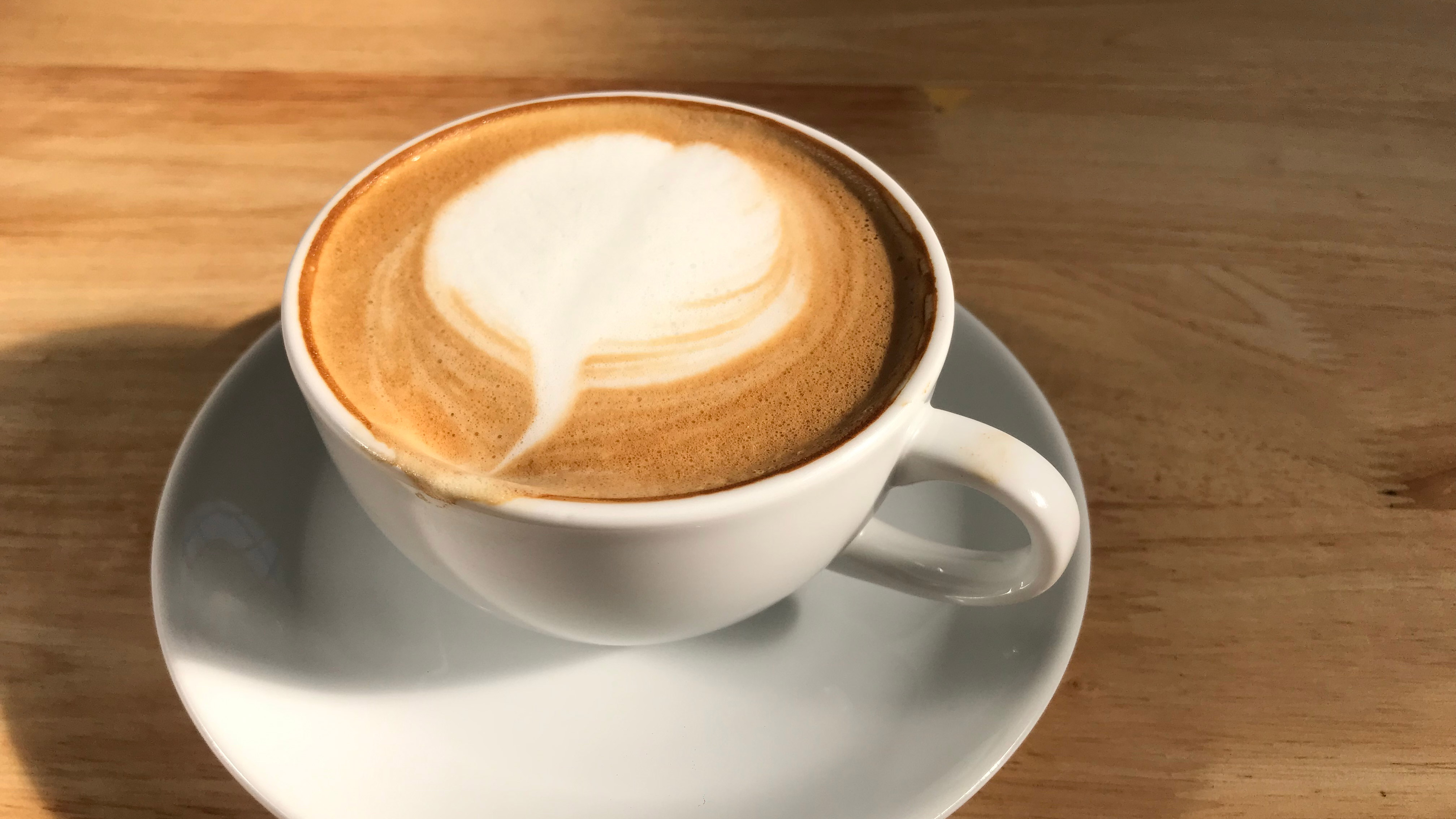 A coffee with lattee art on the top