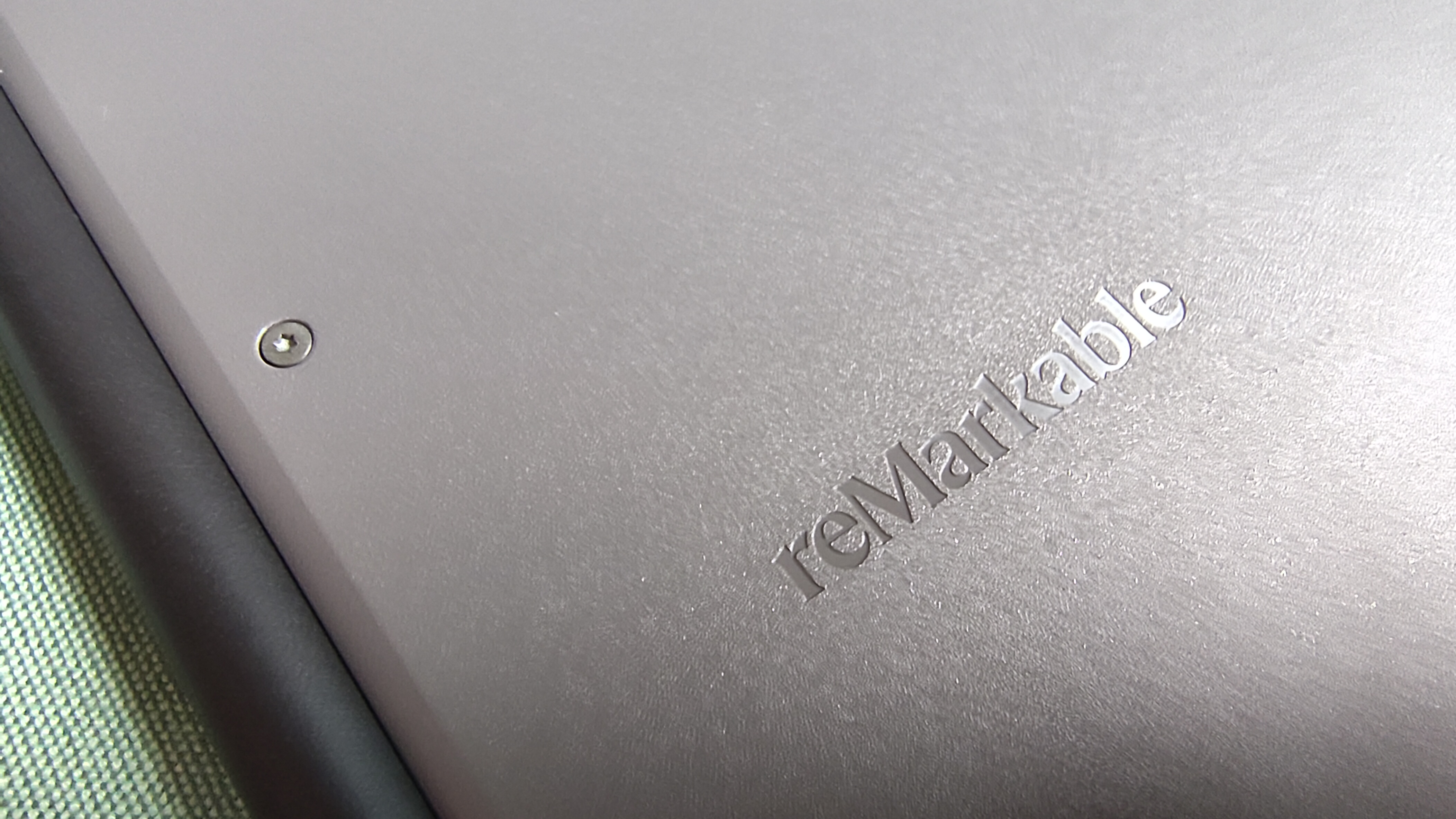 The rear of the reMarkable Paper Pure showing the textured plastic casing, the screws, and the company logo