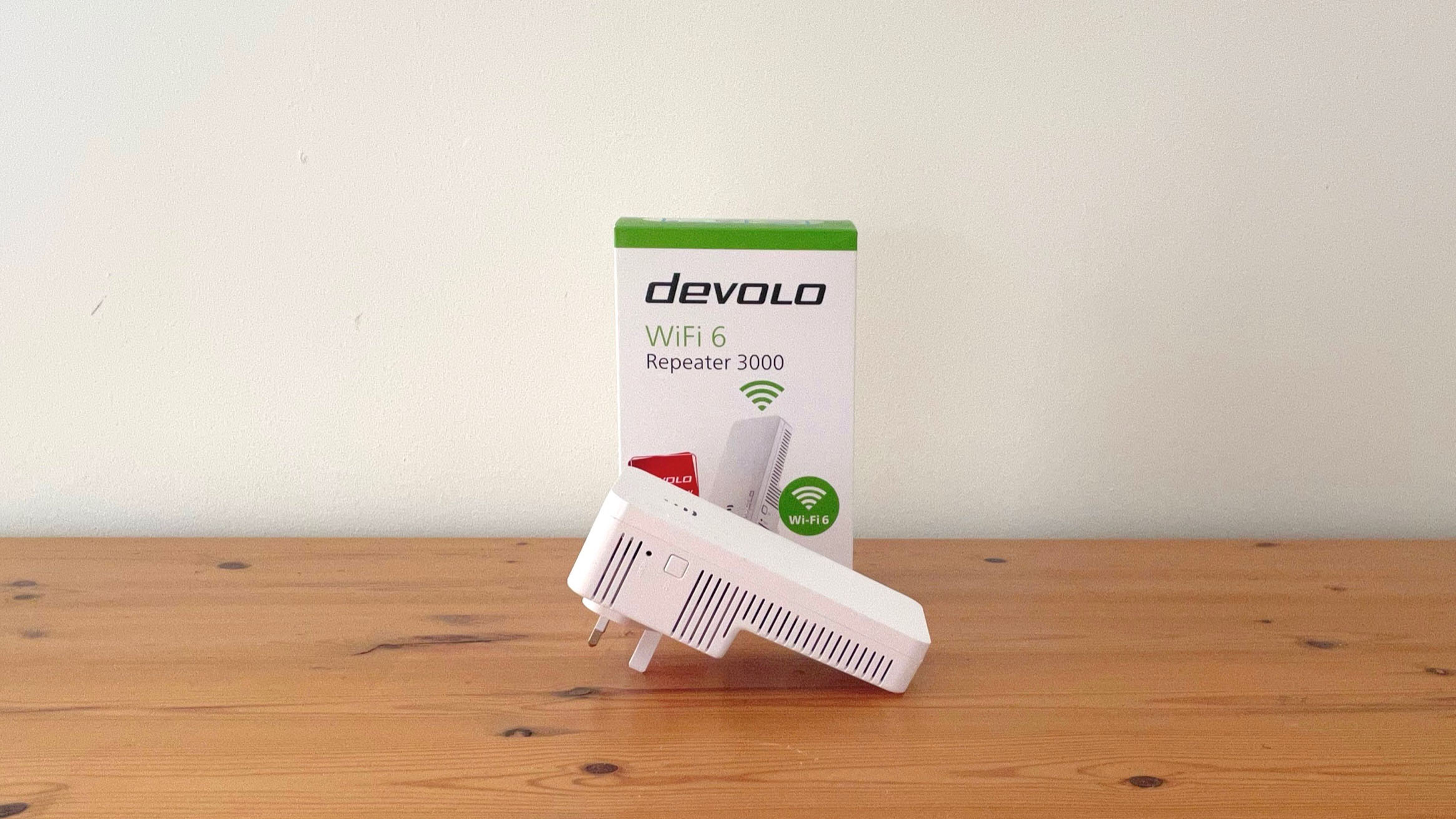 Devolo WiFi 6 Repeater 3000 on a wooden desk