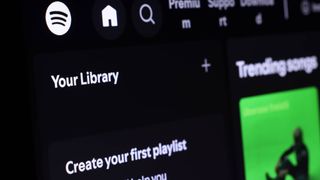 Spotify interface showing library and playlist creation options.