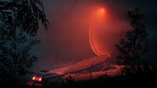 Car driving into tunnel lit red
