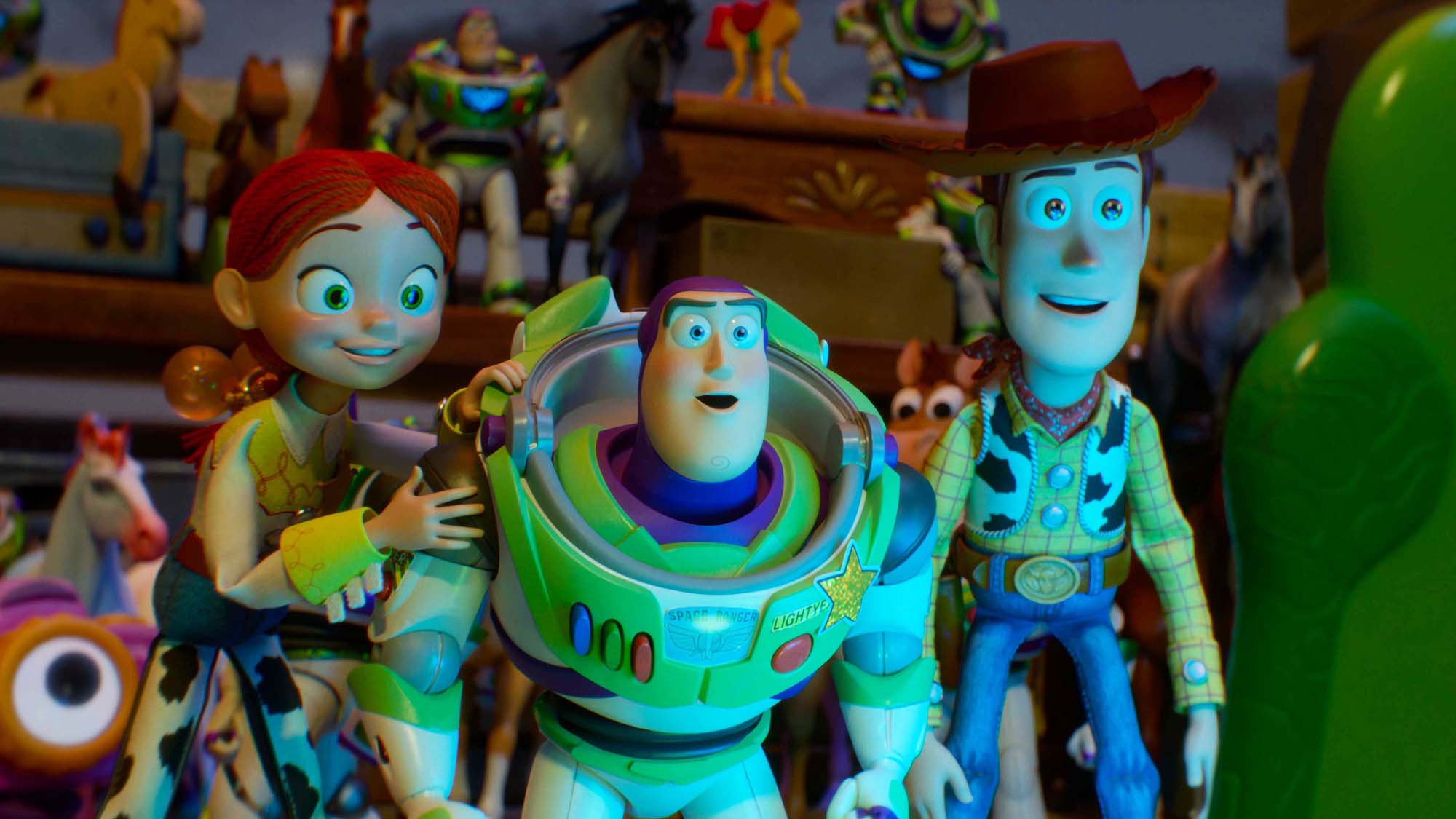 Jessie, Buzz, and Woody smiling as they look at an off-camera Lilypad's screen in Toy Story 5