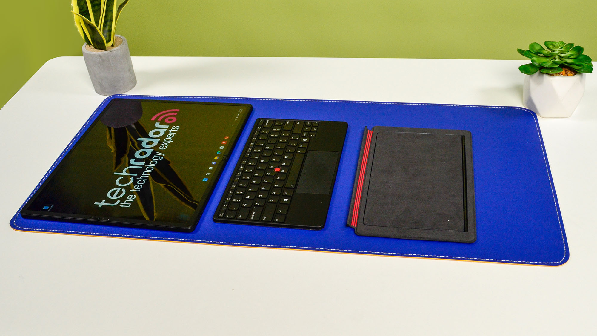 A Lenovo ThinkPad X1 Fold 16 Gen 1 on a white desk