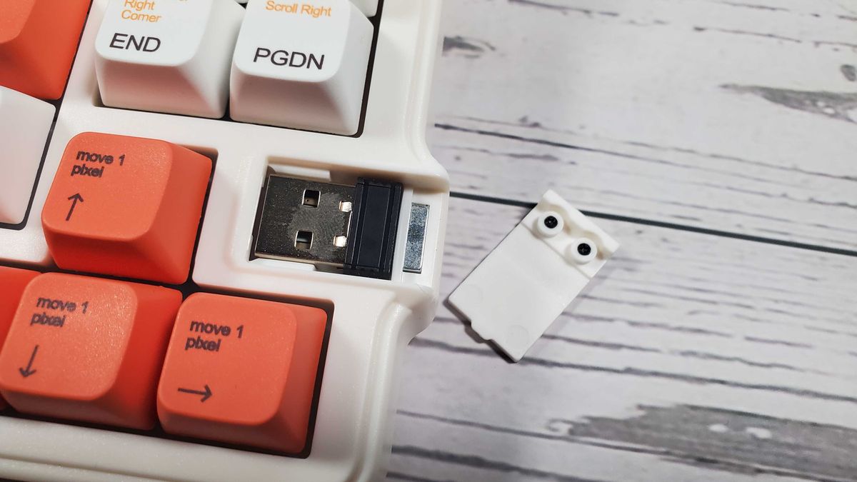white and orange mechanical keyboard